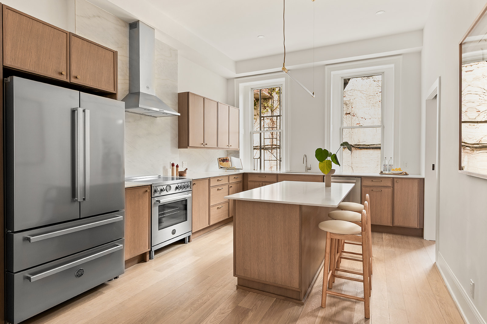 109 2nd Place Brooklyn, NY 11231 - Photo 2 of 26 a kitchen with stainless steel appliances a refrigerator a stove a sink and white cabinets