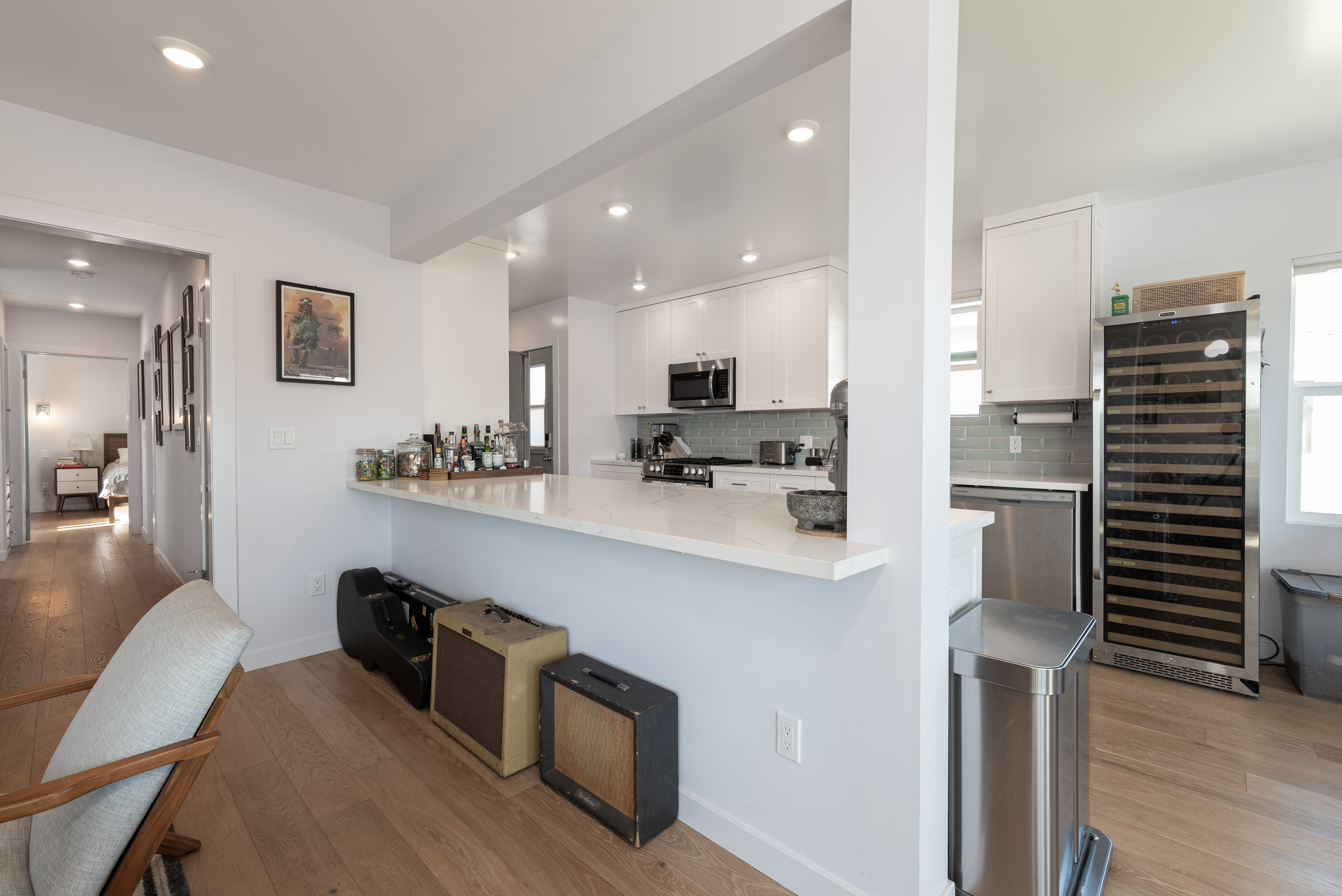 1005 Alexandria Avenue Los Angeles, CA 90029 - Photo 5 of 21 a kitchen with kitchen island white cabinets and stainless steel appliances