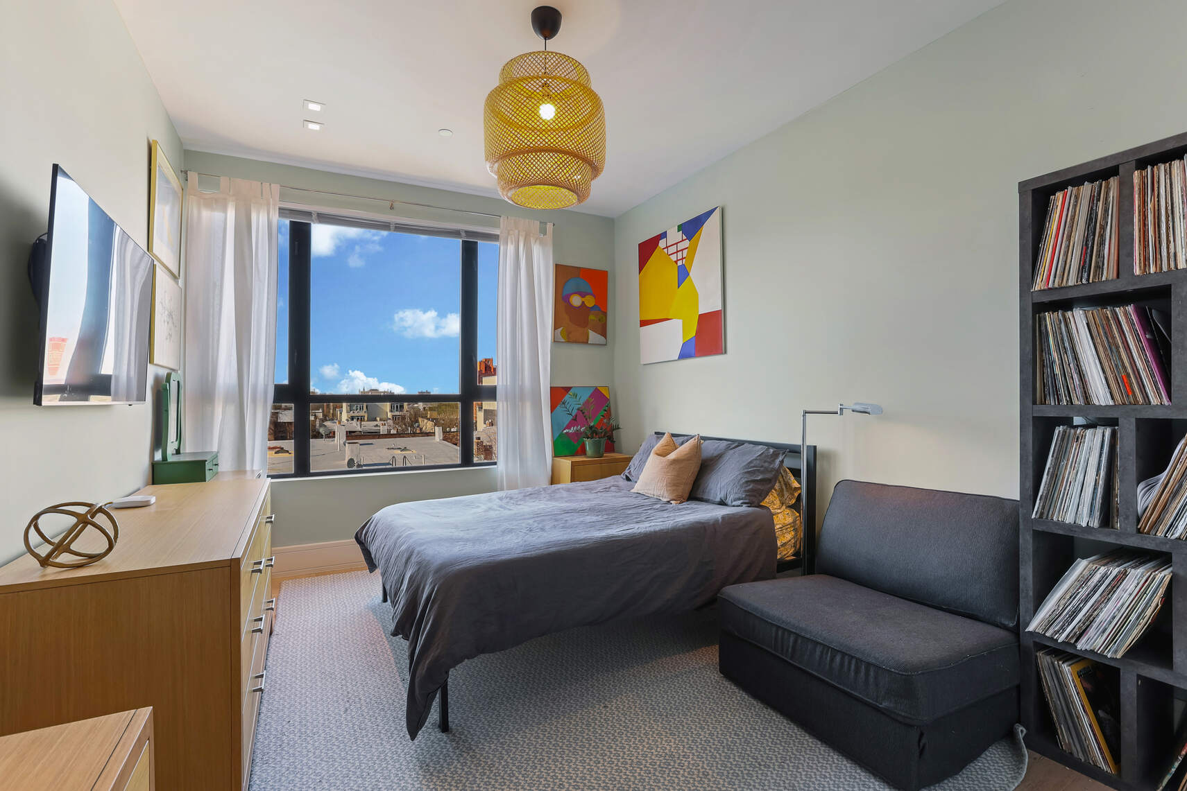 288 19th Street, Unit 3 Brooklyn, NY 11215 - Photo 17 of 26 a bedroom with a bed furniture and a flat screen tv