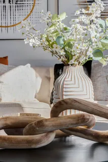 a vase of flowers sitting on a table