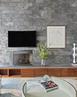a living room with fireplace furniture and a flat screen tv