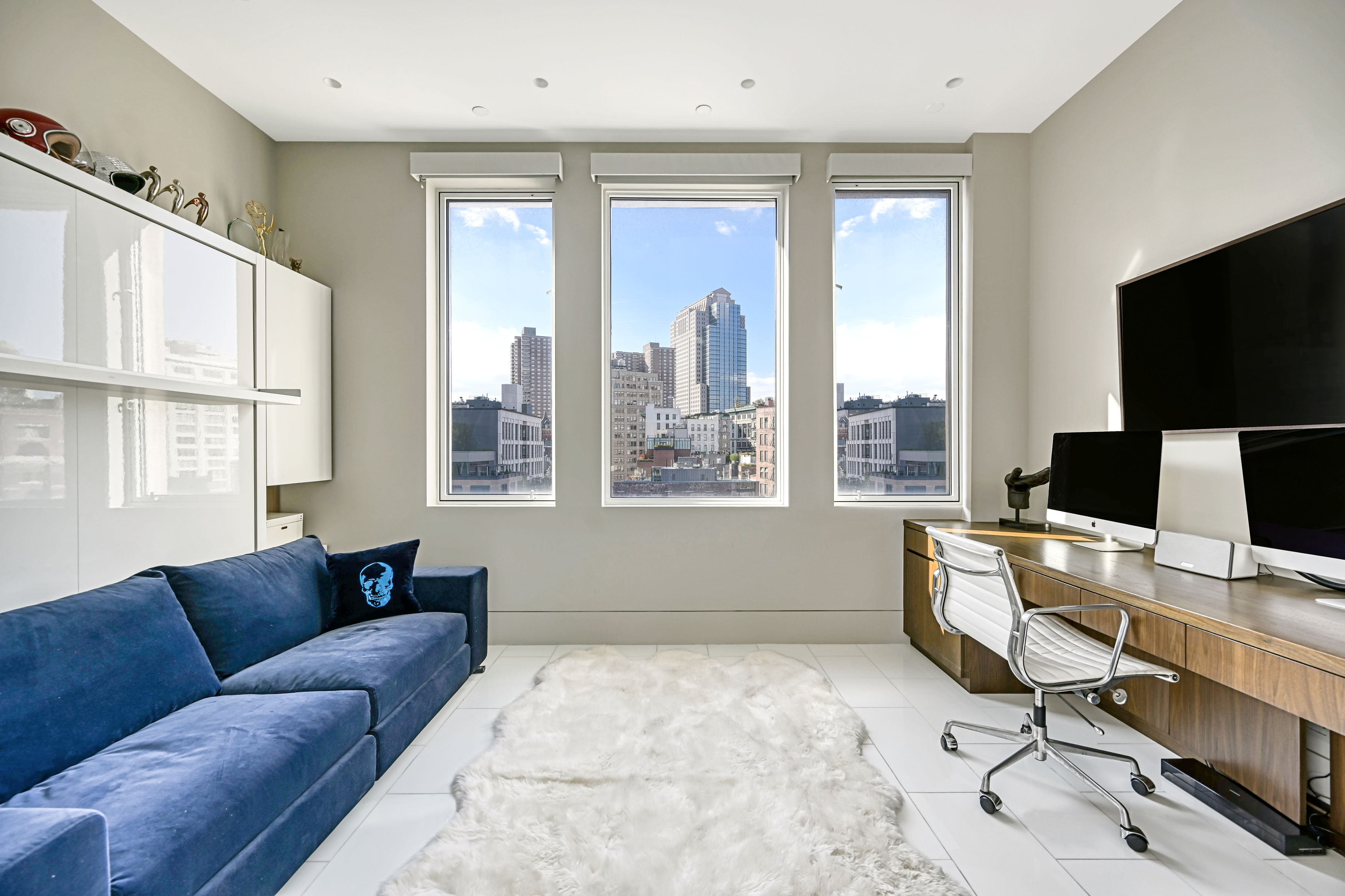53 Leonard Street, Unit PH Manhattan, NY 10013 - Photo 11 of 24 a living room with furniture and a flat screen tv