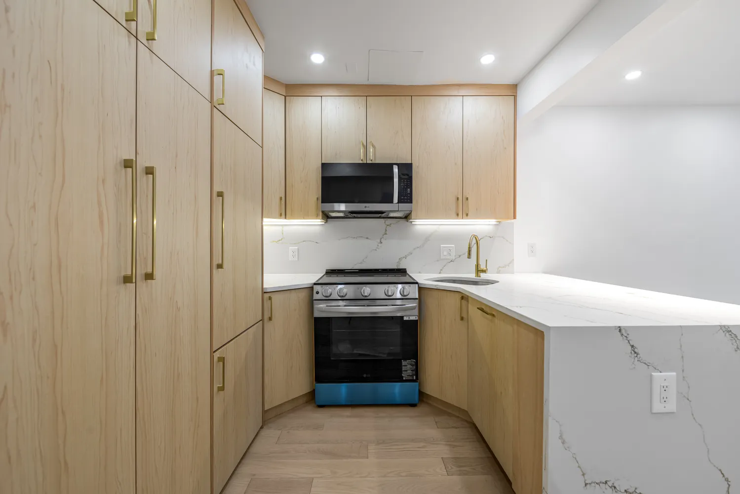 a kitchen with a sink and a stove top oven