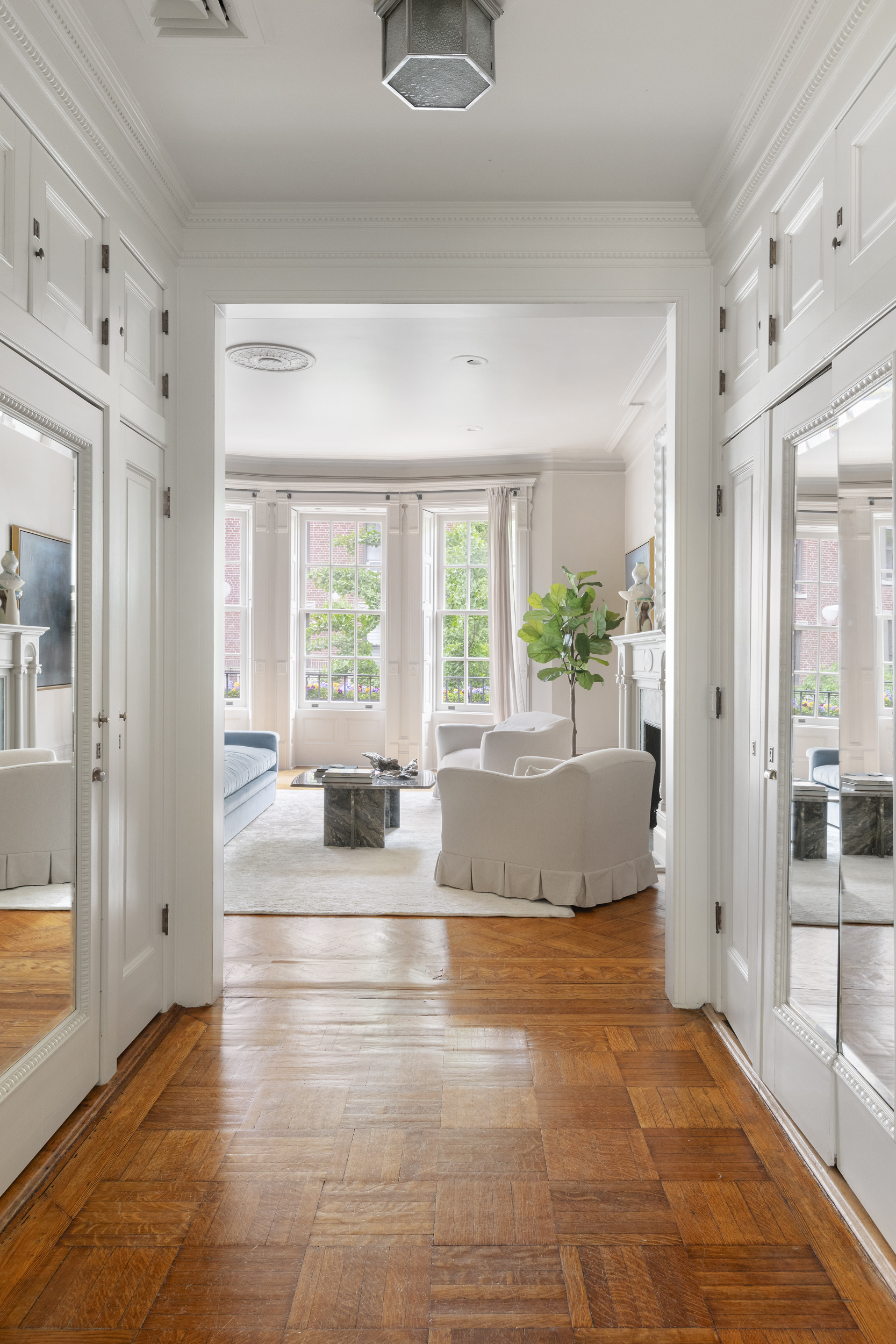 37 West 70th Street Manhattan, NY 10023 - Photo 23 of 41 a living room with hardwood floor and large window