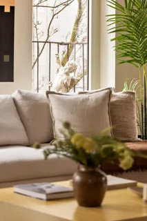 a living room with a couch and a window