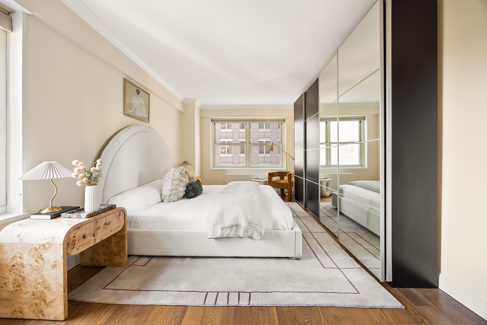 159 West 53rd Street, Unit 27H Manhattan, NY 10019 - Photo 7 of 15 a bedroom with a large bed and a window