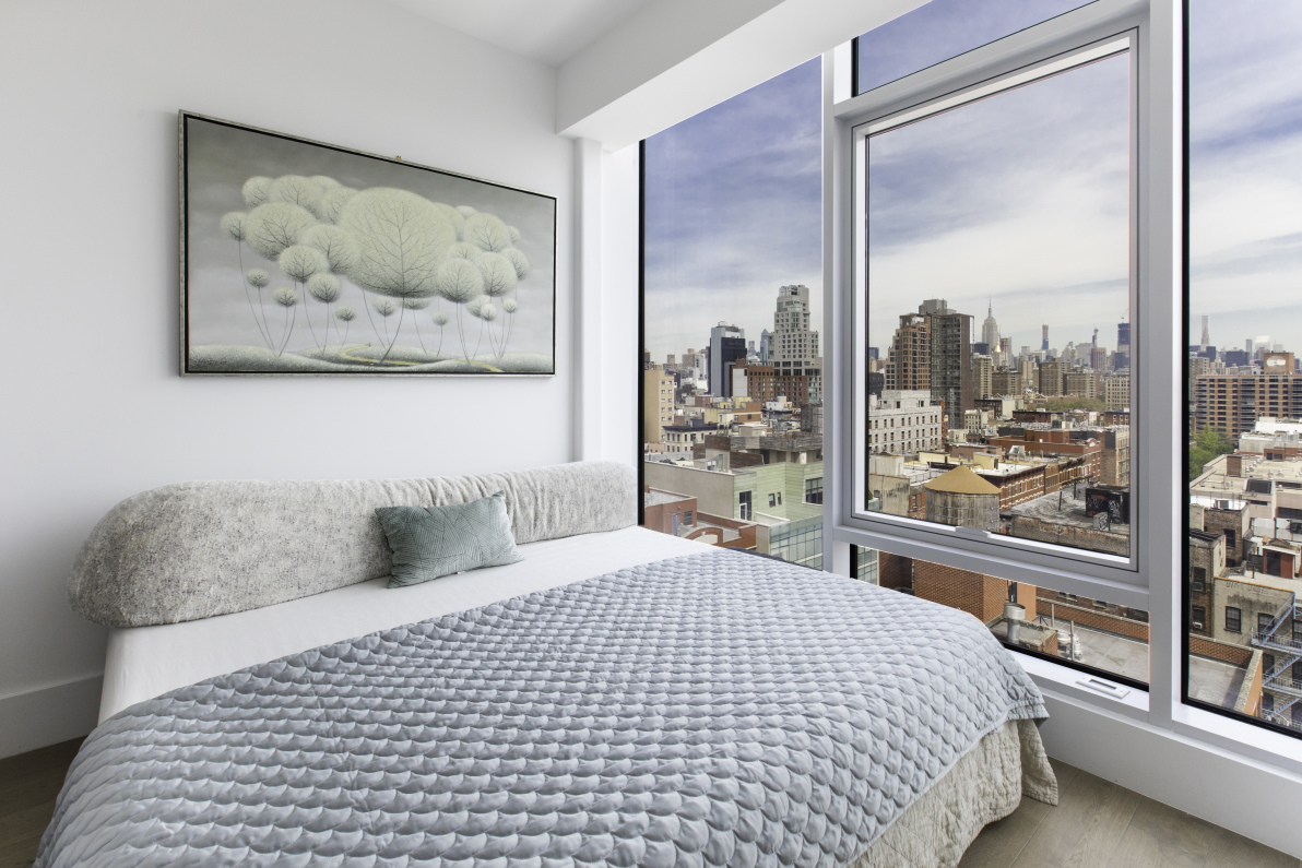 100 Norfolk Street, Unit PH Manhattan, NY 10002 - Photo 17 of 23 a bedroom with a large bed and a painting on the wall