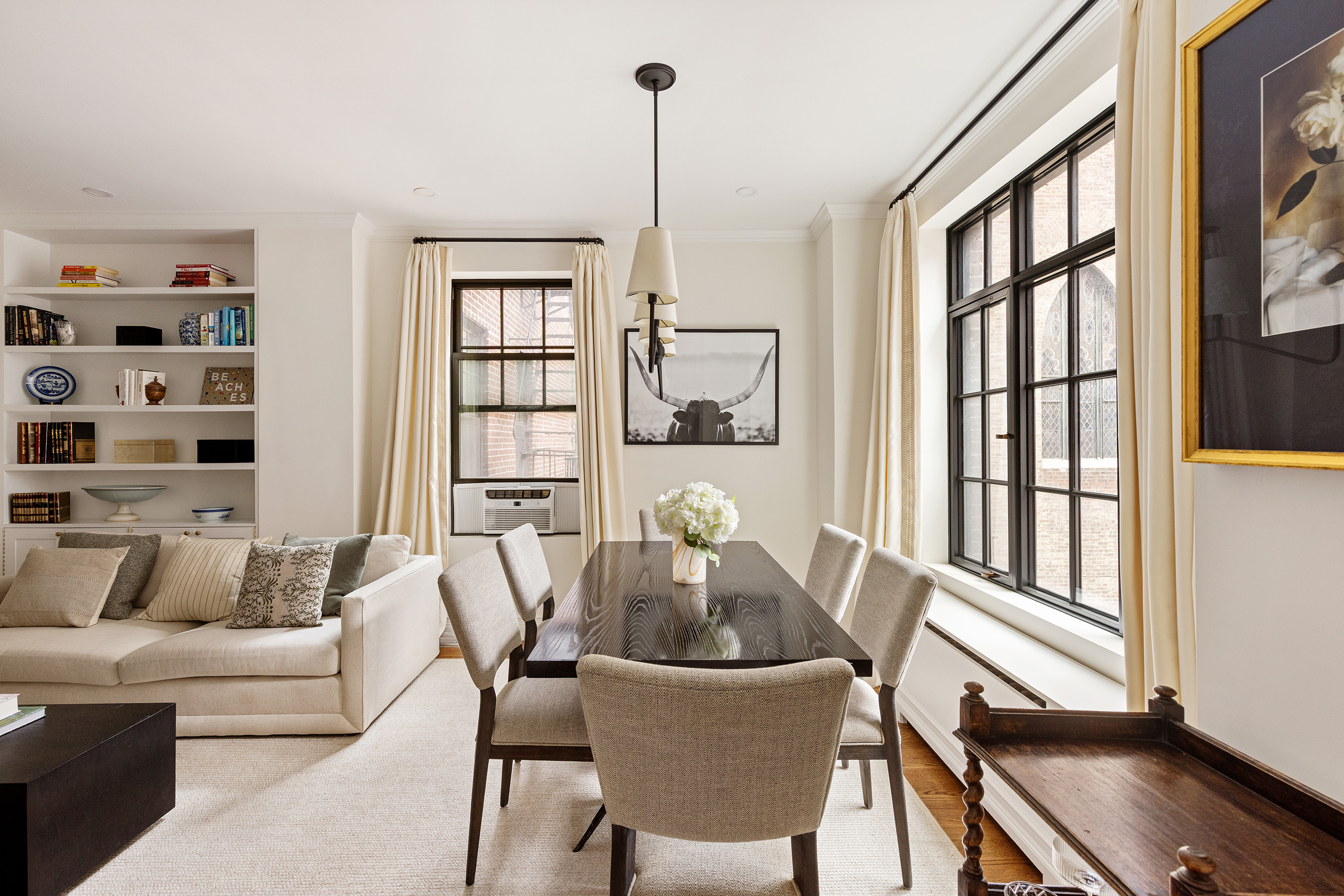15 West 11th Street, Unit 3C Manhattan, NY 10011 - Photo 2 of 10 a living room with furniture and a window