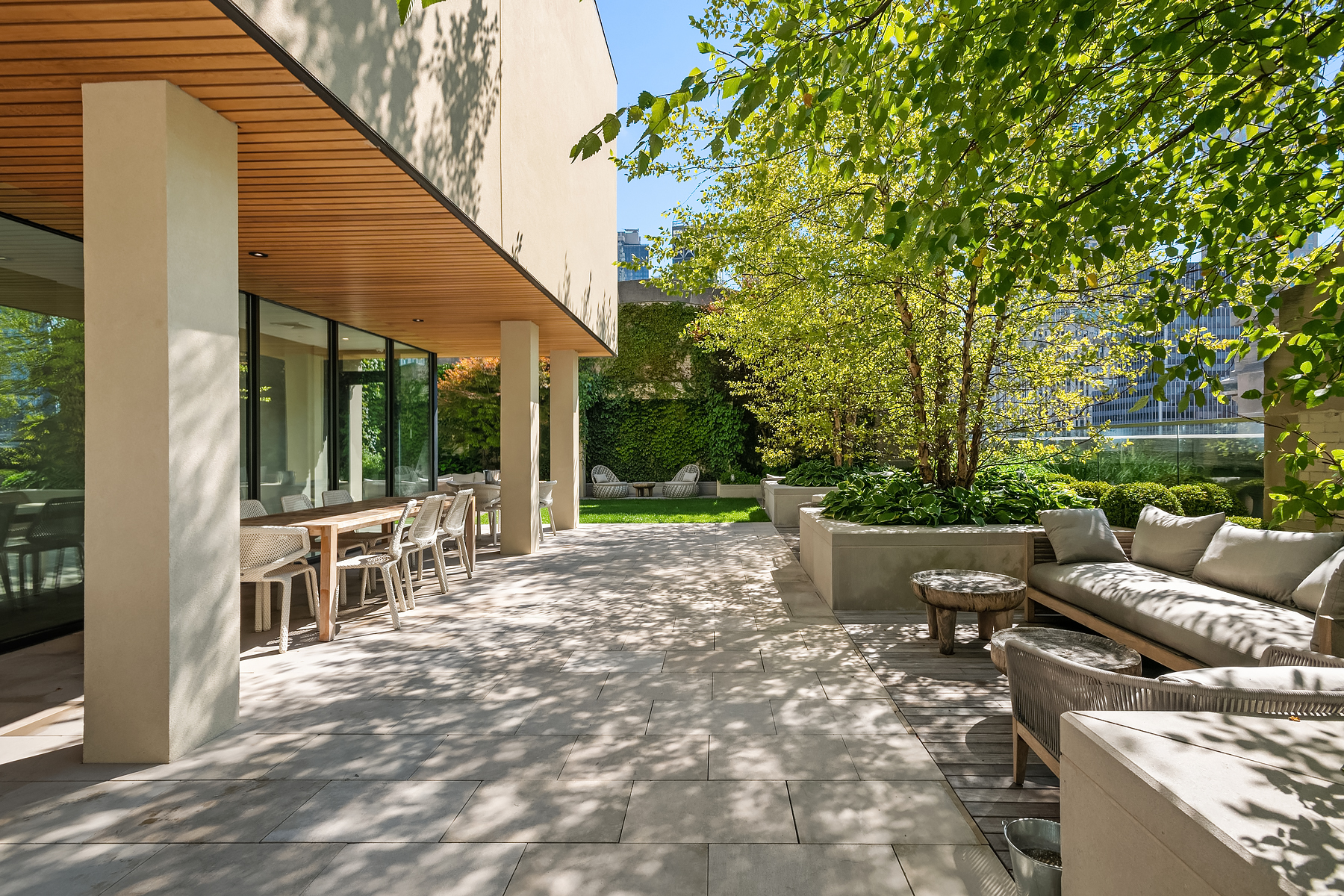 49 Chambers Street, Unit 11D Manhattan, NY 10007 - Photo 25 of 30 a view of a patio with couches table and chairs and potted plants