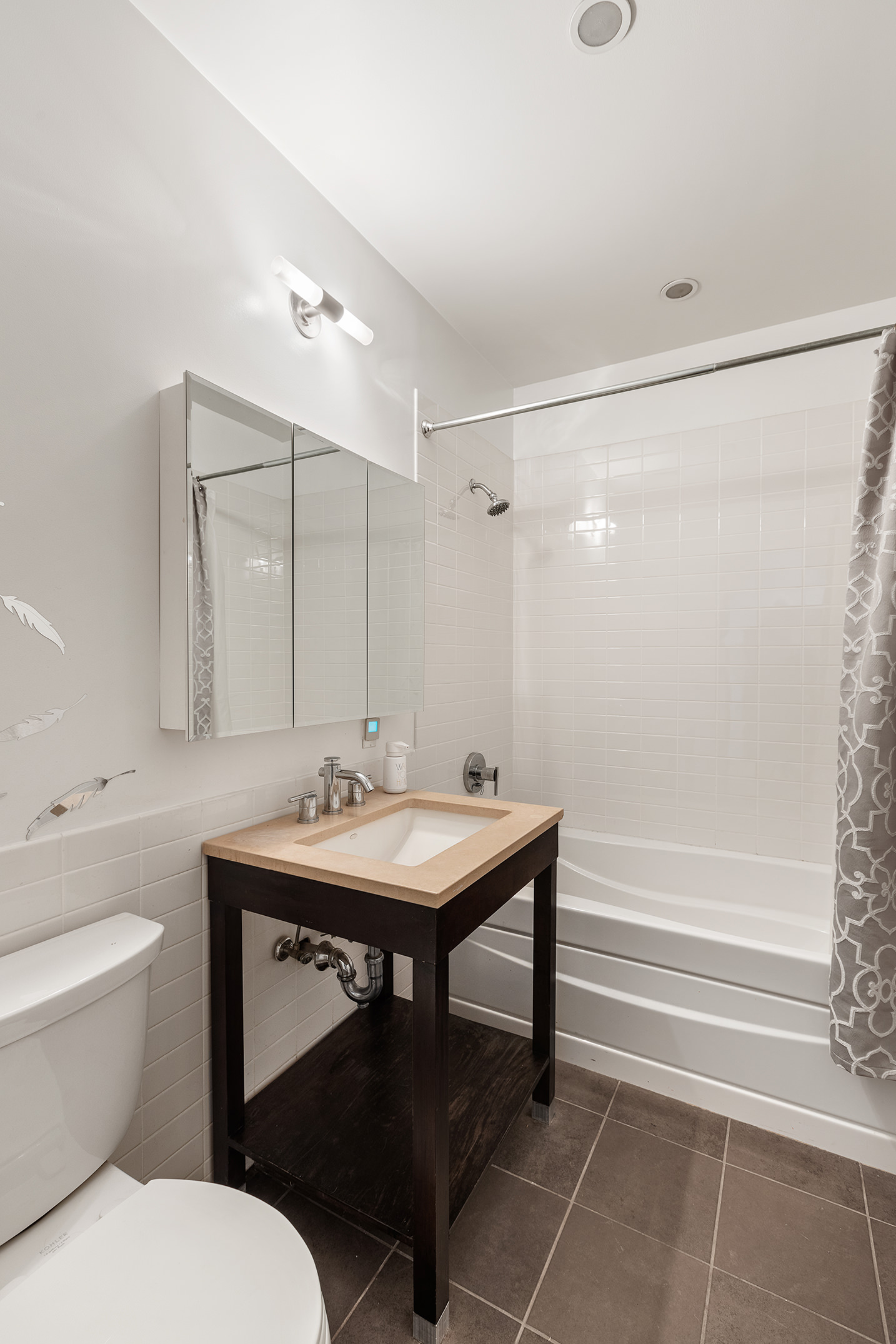 365 Bridge Street, Unit 8I Brooklyn, NY 11201 - Photo 9 of 10 a bathroom with a sink toilet and shower