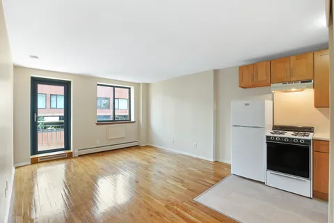 an empty room with a kitchen