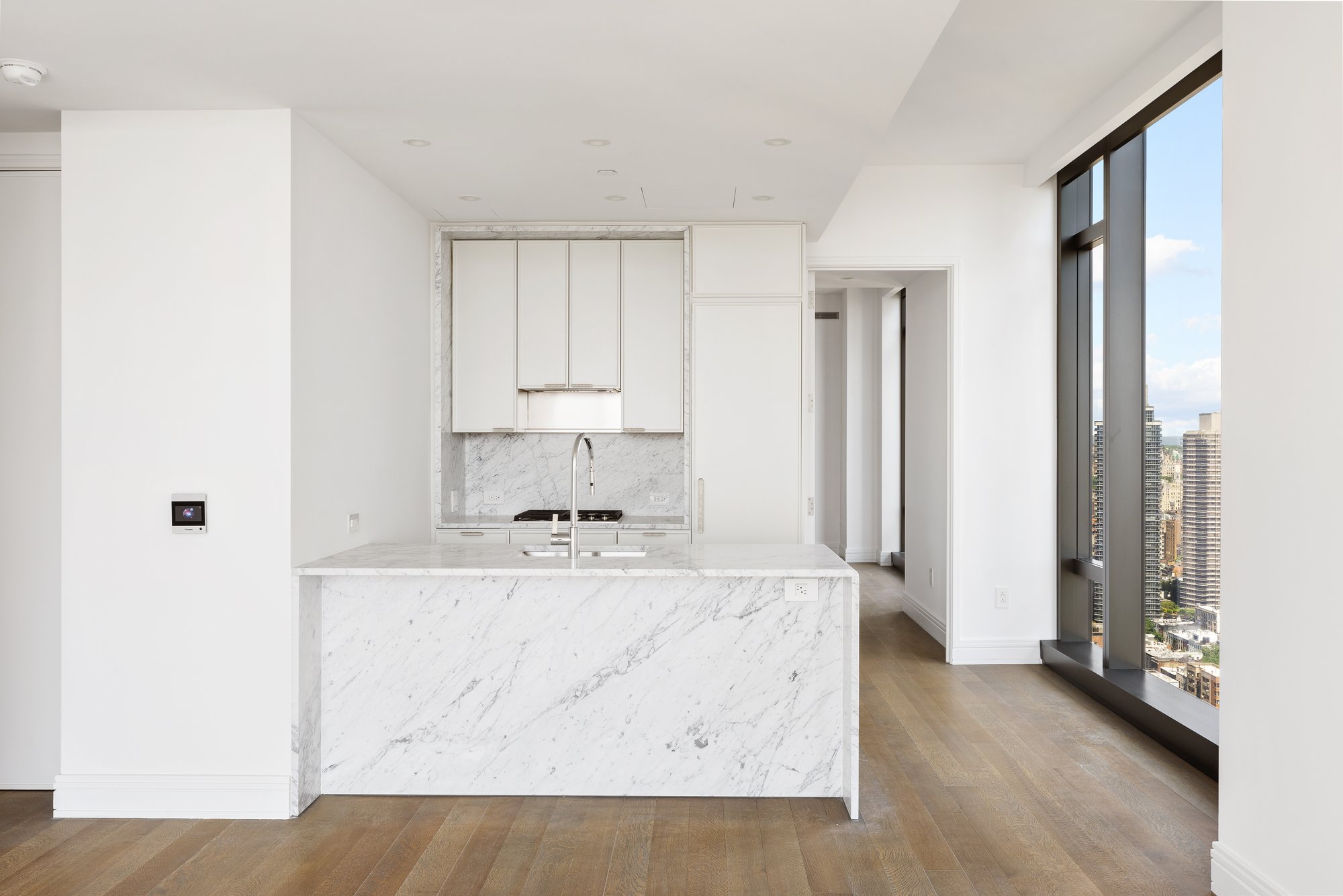430 East 58th Street, Unit 39A Manhattan, NY 10022 - Photo 4 of 15 a kitchen with stainless steel appliances granite countertop a refrigerator and a stove