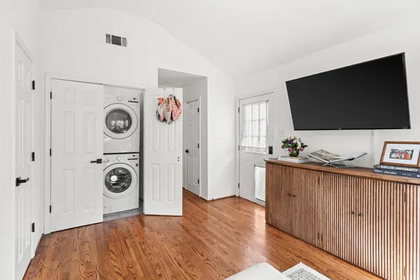a view of a livingroom with furniture and a flat screen tv
