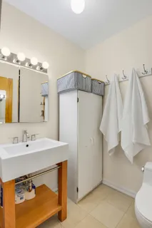 a bathroom with a sink vanity and a mirror