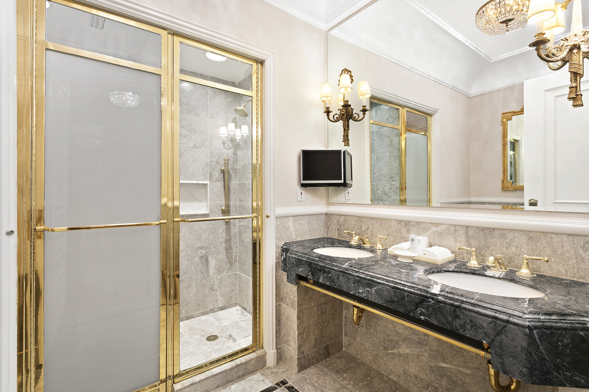 2 East 55th Street, Unit 1116 Manhattan, NY 10022 - Photo 6 of 14 a bathroom with a granite countertop sink mirror and double