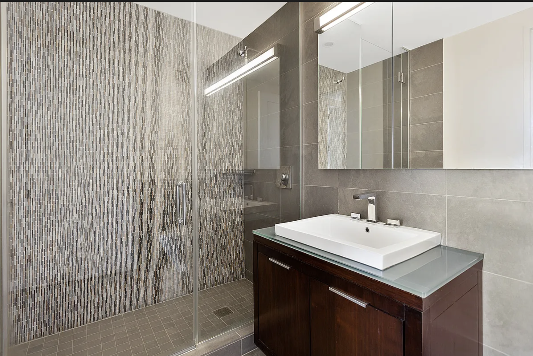 22 North 6th Street, Unit 12J Brooklyn, NY 11249 - Photo 4 of 13 a bathroom with a sink and a mirror