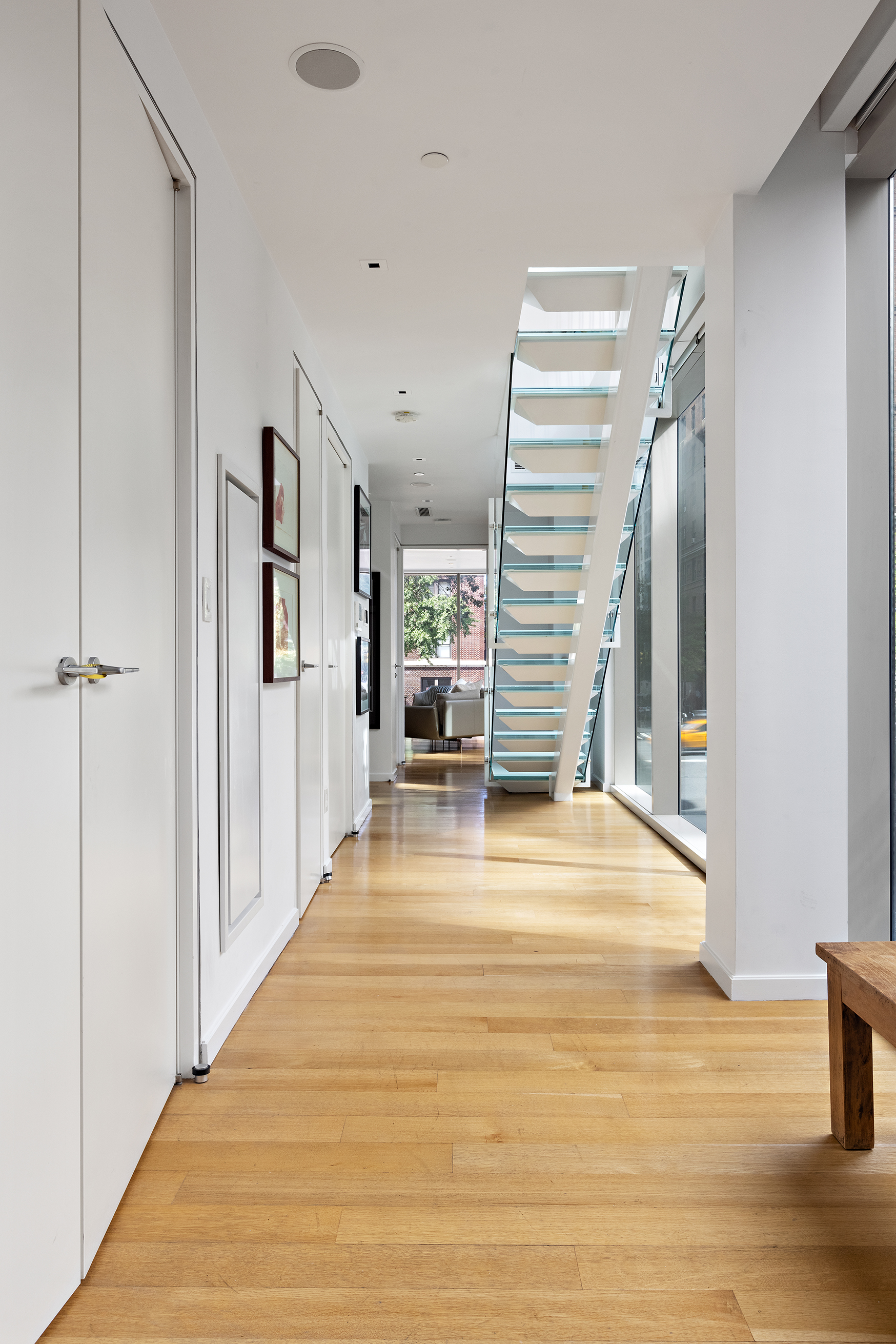 1055 Park Avenue, Unit 1 Manhattan, NY 10028 - Photo 6 of 19 a view of a hall with wooden floor and staircase