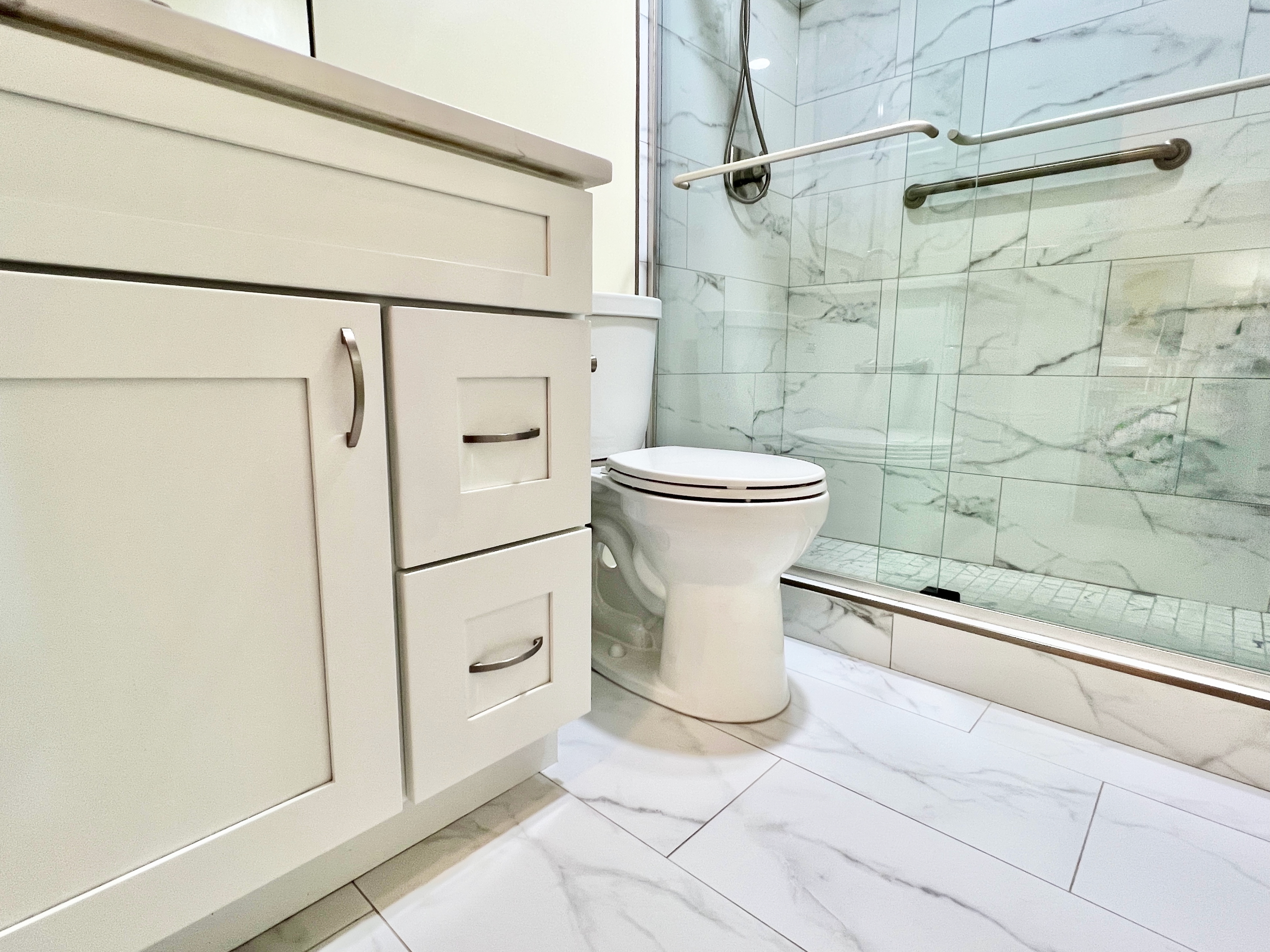 490 M Street Southwest, Unit W304 Washington, DC 20024 - Photo 22 of 36 a white toilet sitting next to a bathroom