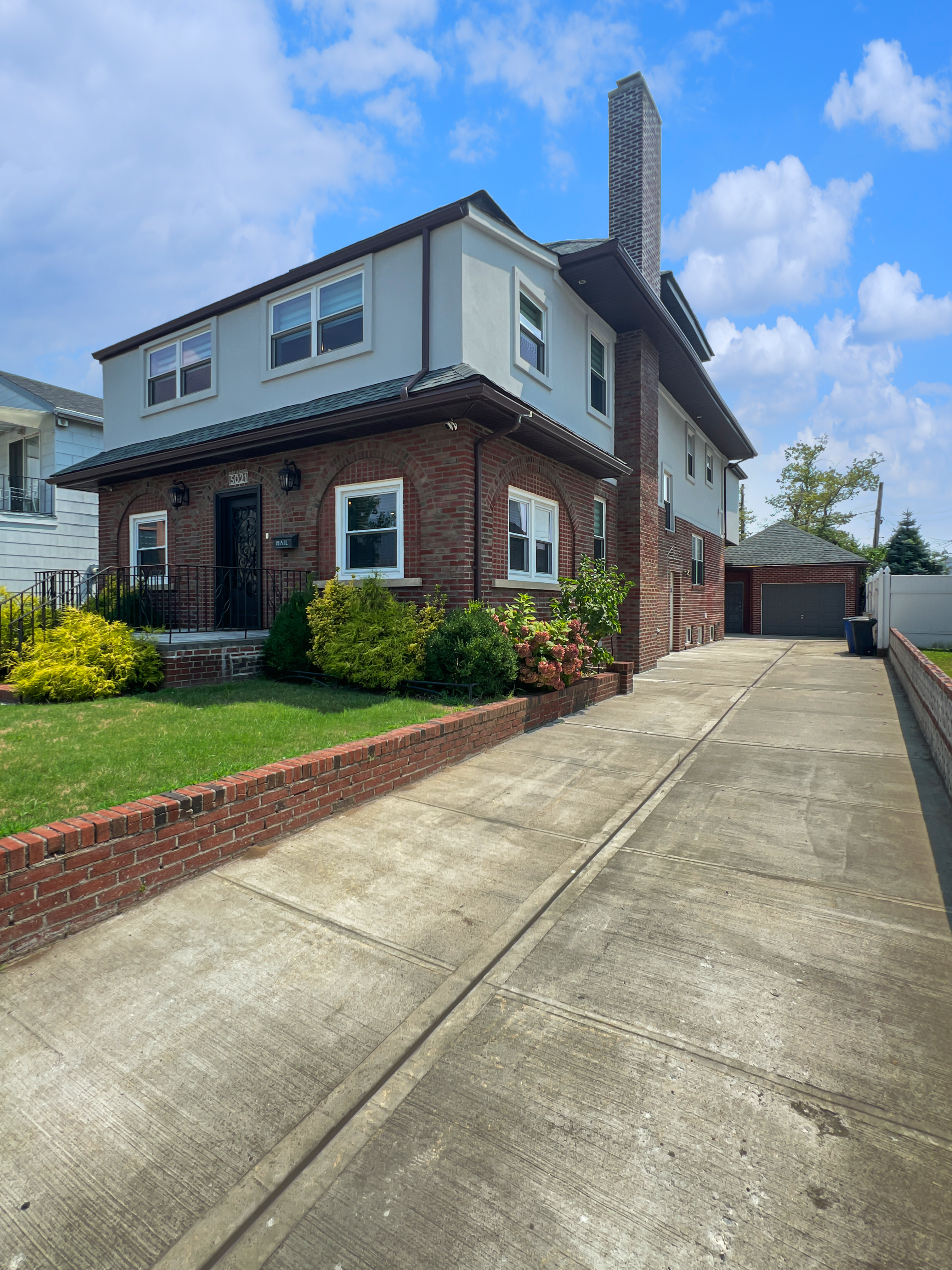 5021 Surf Avenue Brooklyn, NY 11224 - Photo 27 of 32 a front view of a house with a yard