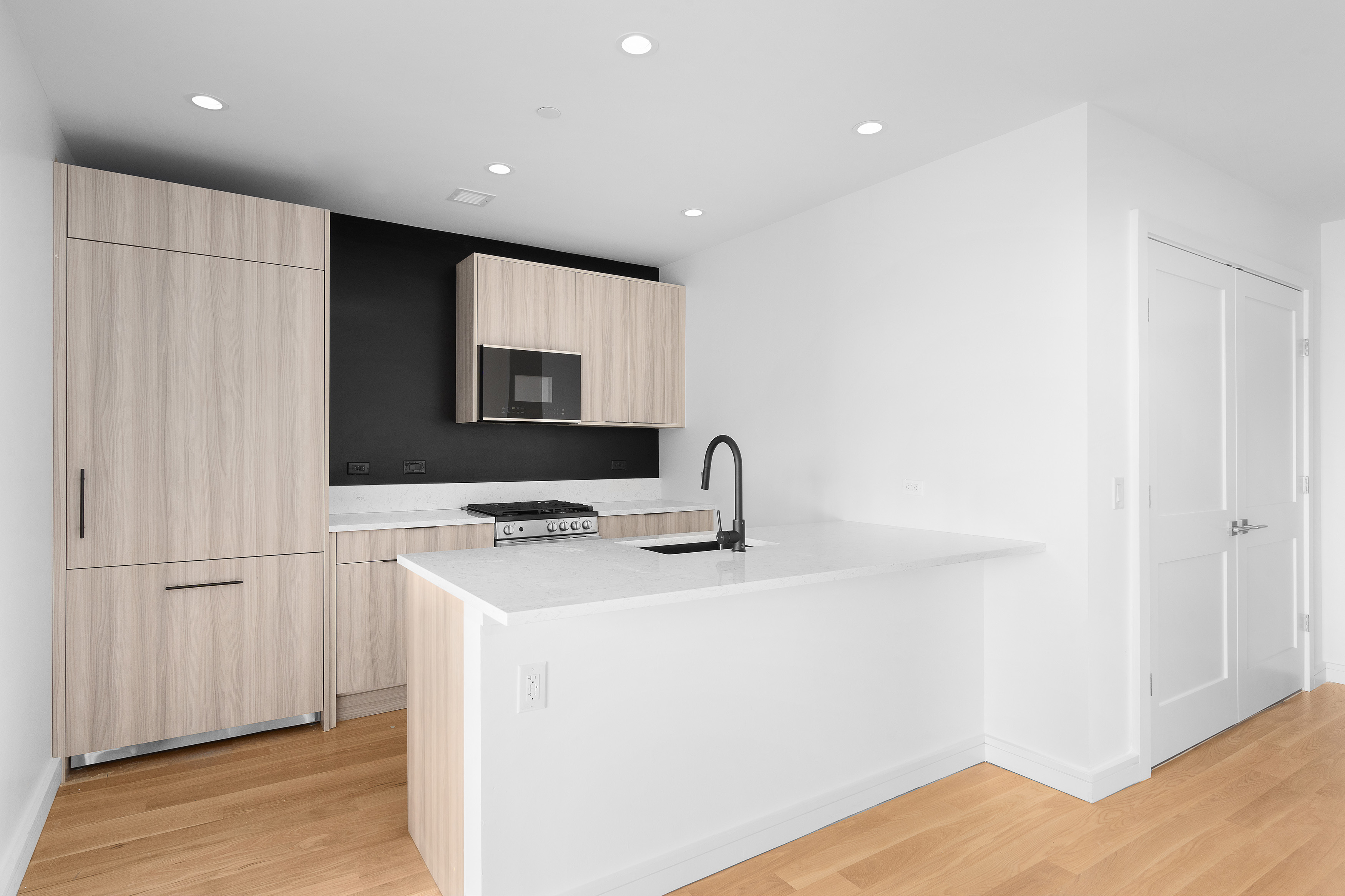 927 Atlantic Avenue, Unit 7A Brooklyn, NY 11238 - Photo 4 of 16 a kitchen with a sink and a refrigerator