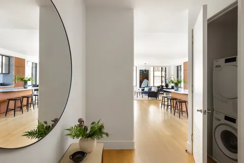 a view of a living room and dining room