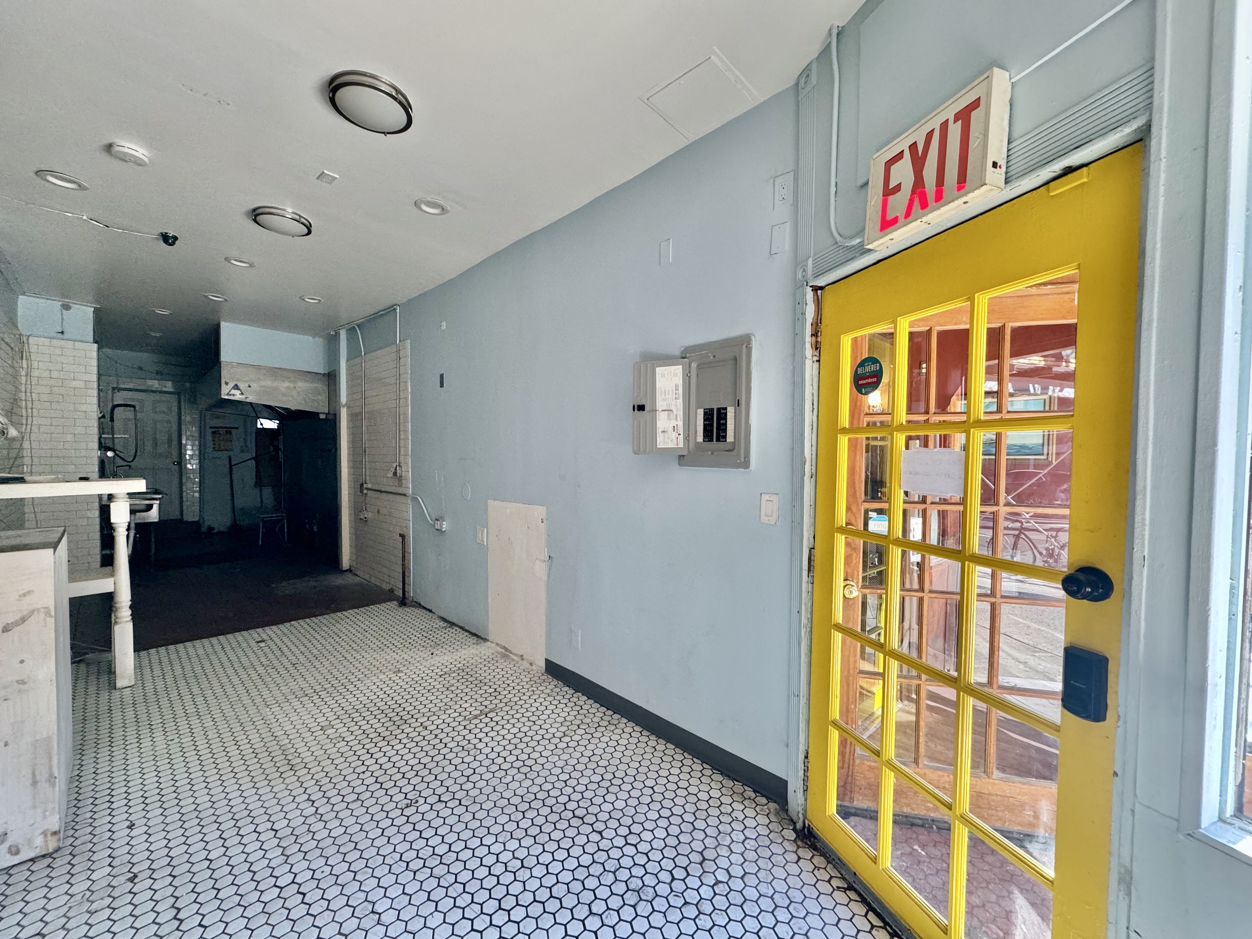 393 Classon Avenue, Unit CML1 Brooklyn, NY 11238 - Photo 3 of 8 a view of a hallway with a dining table & chairs