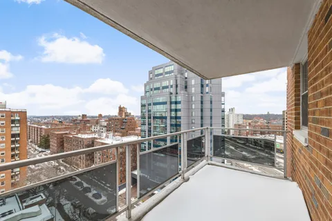 a view of a balcony with city view