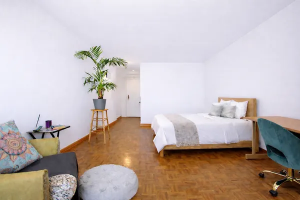 a bed room with a bed and a couch