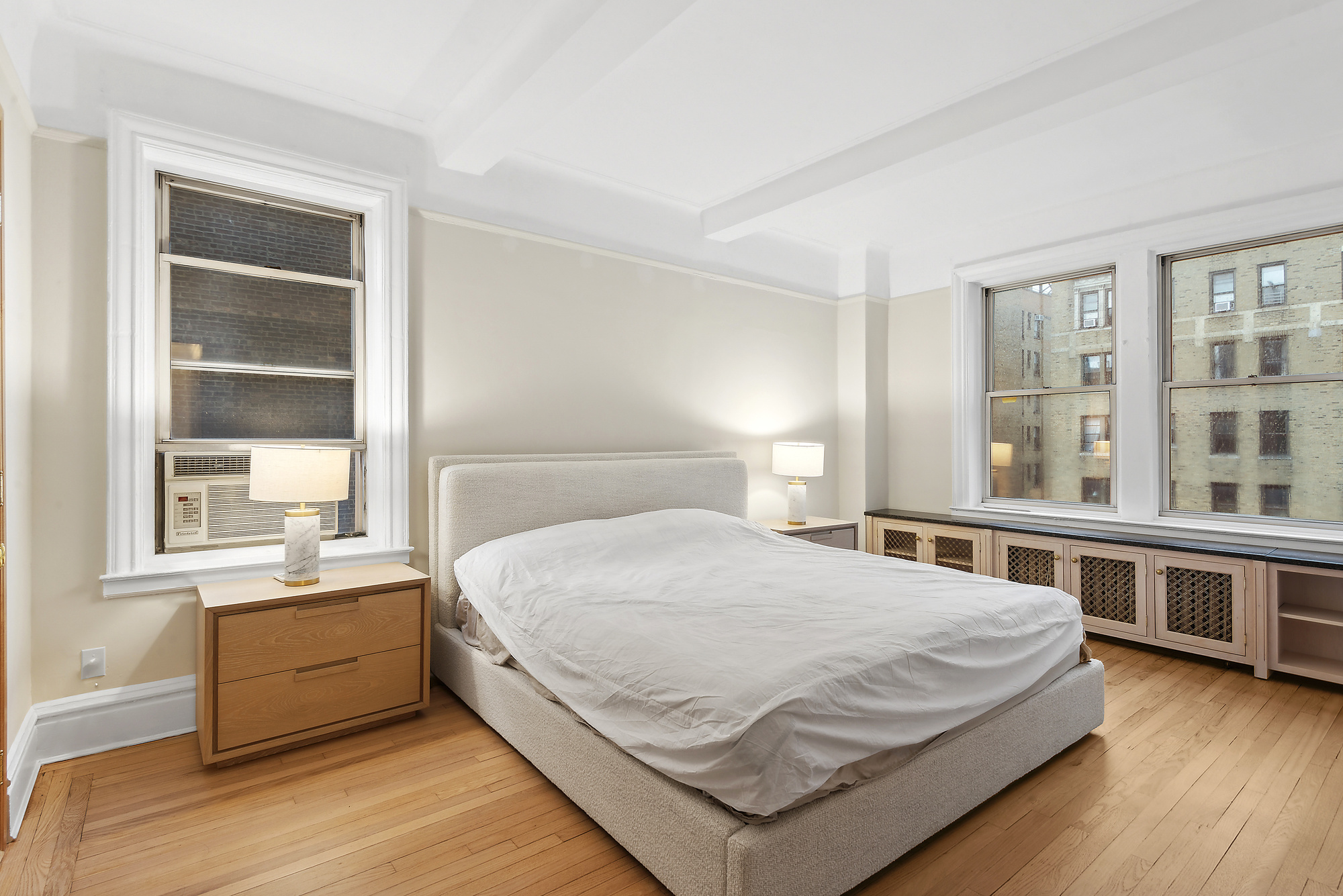 145 West 86th Street, Unit 12B Manhattan, NY 10024 - Photo 4 of 12 a bedroom with a bed and a large window
