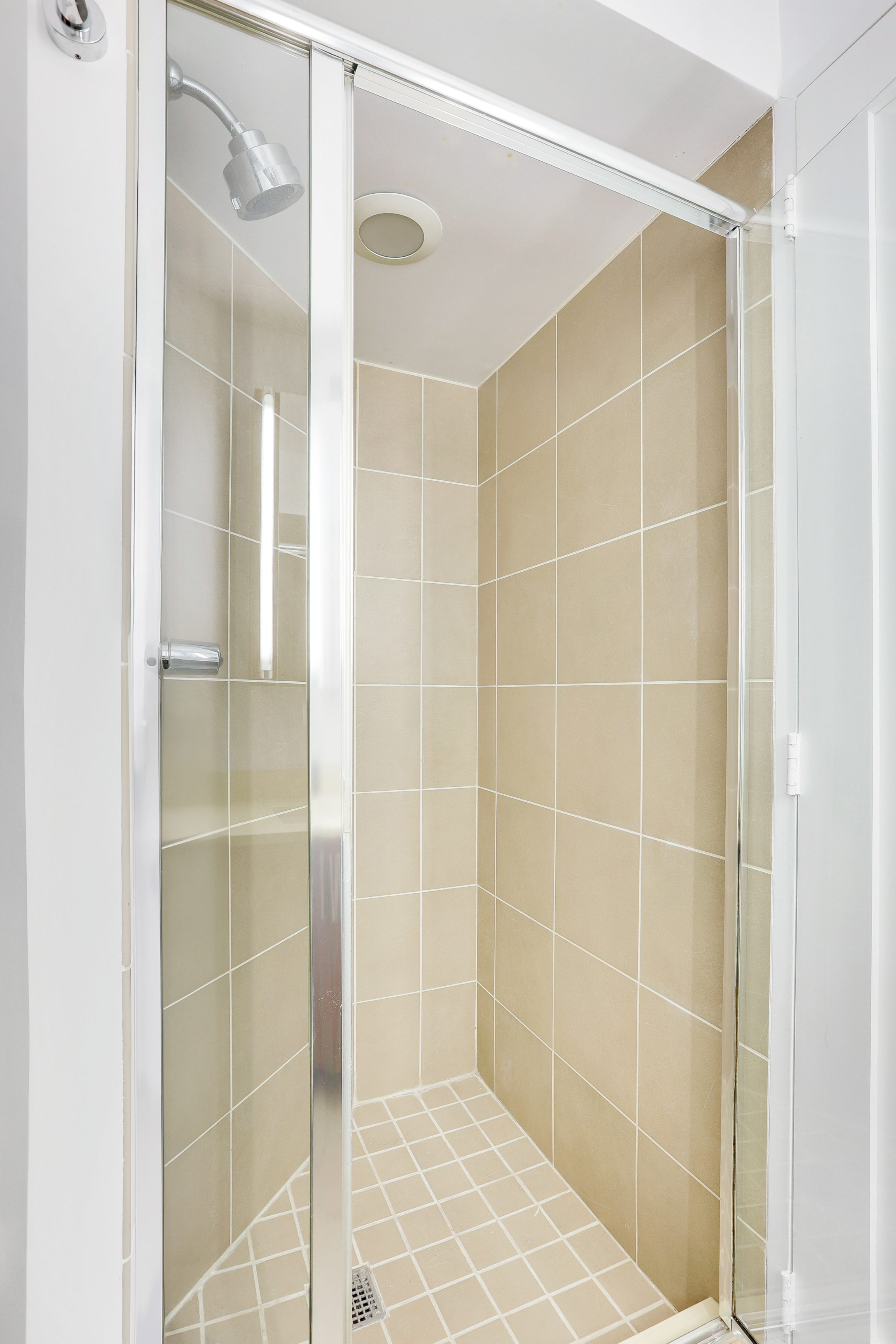 330 East 38th Street, Unit 20E Manhattan, NY 10016 - Photo 9 of 17 a bathroom with a shower and a glass door