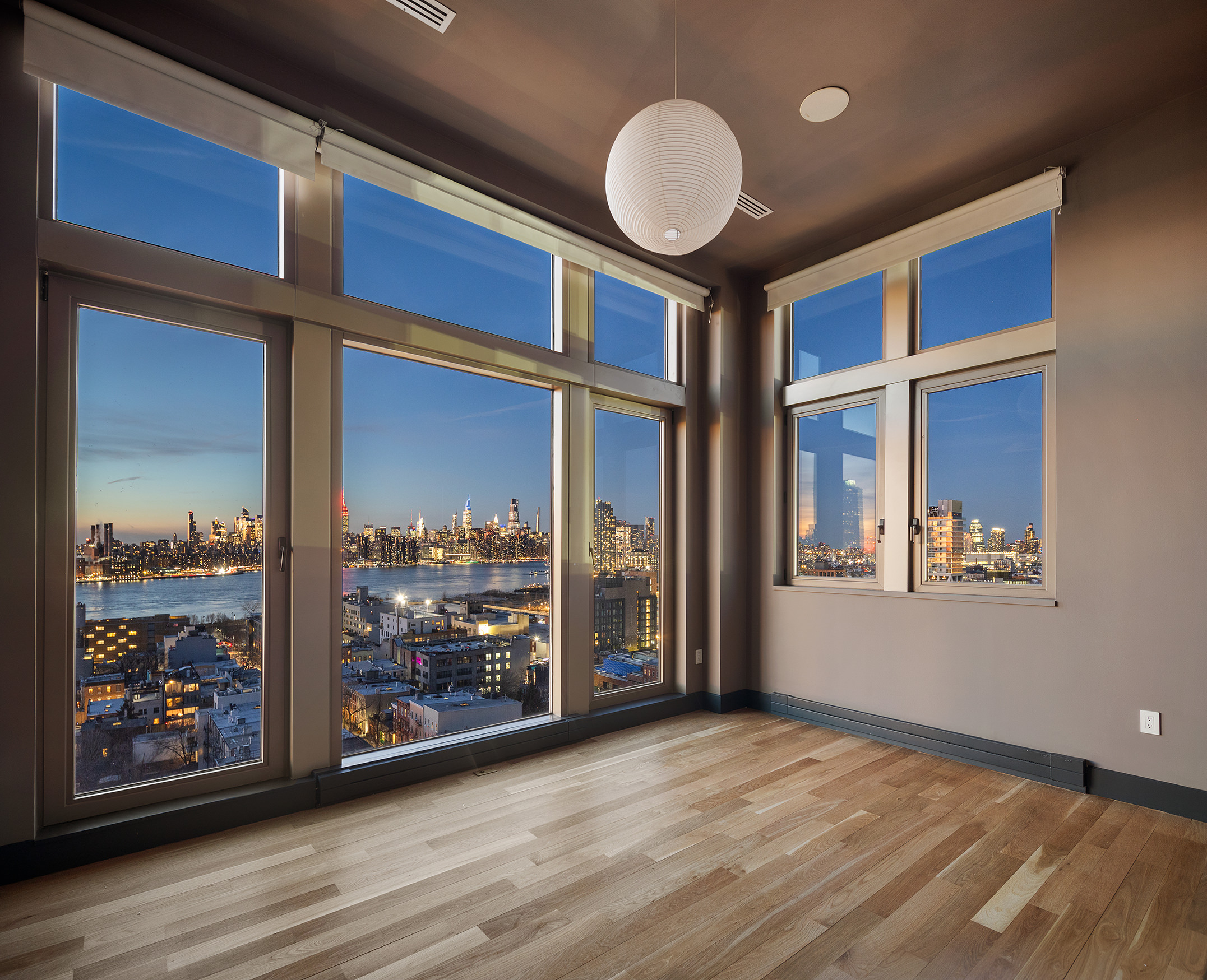 144 North 8th Street, Unit PH2 Brooklyn, NY 11249 - Photo 18 of 20 a view of a room with wooden floor and window