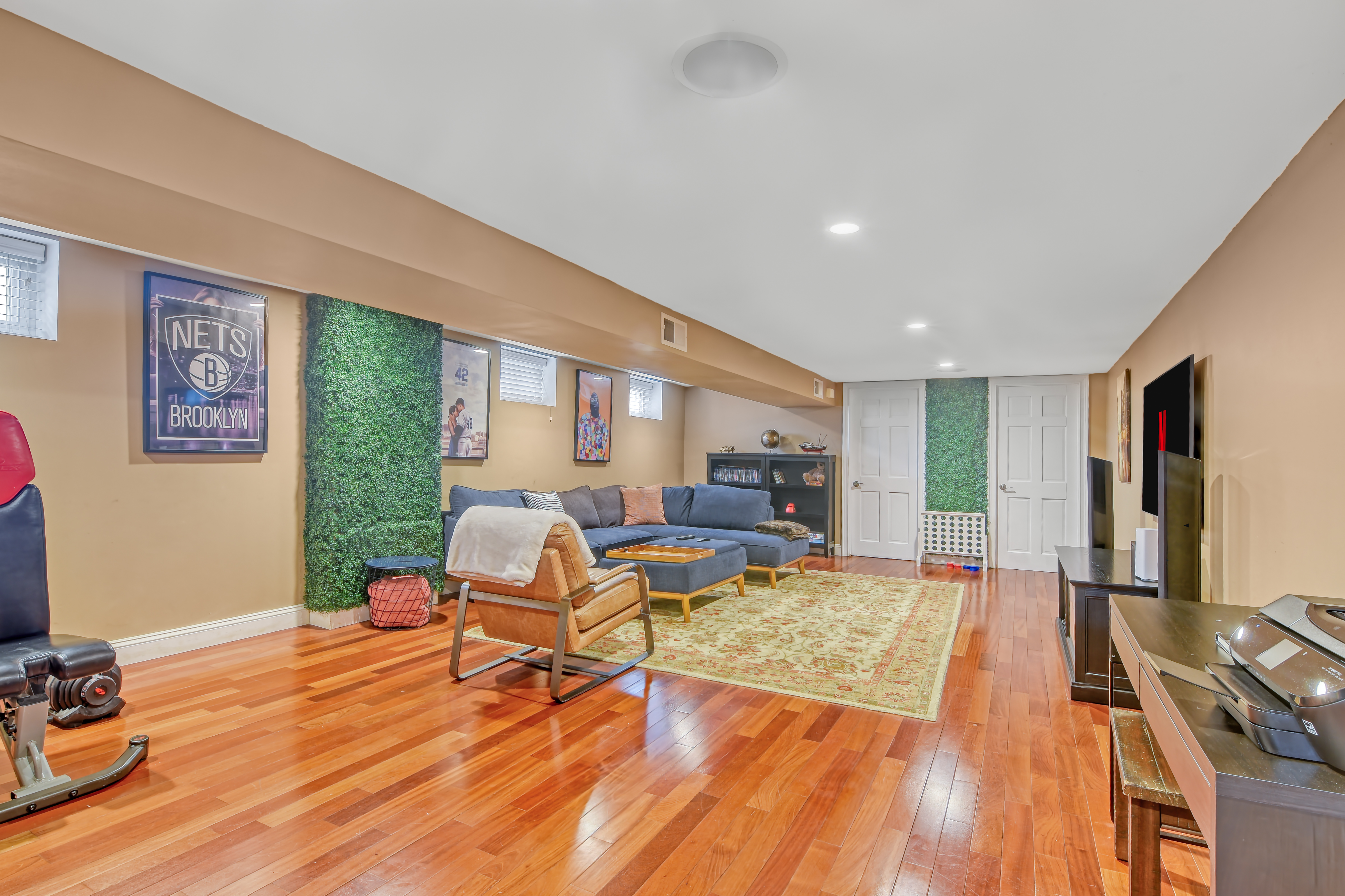 232 Maple Street Brooklyn, NY 11225 - Photo 11 of 16 a living room with furniture and a wooden floor