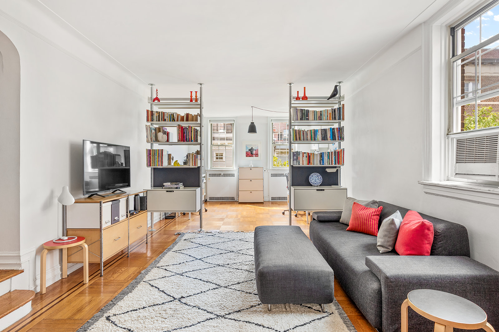 145 Hicks Street, Unit B40 Brooklyn, NY 11201 - Photo 3 of 10 a living room with furniture and a flat screen tv