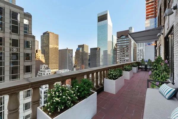 a city view from a balcony with outdoor space
