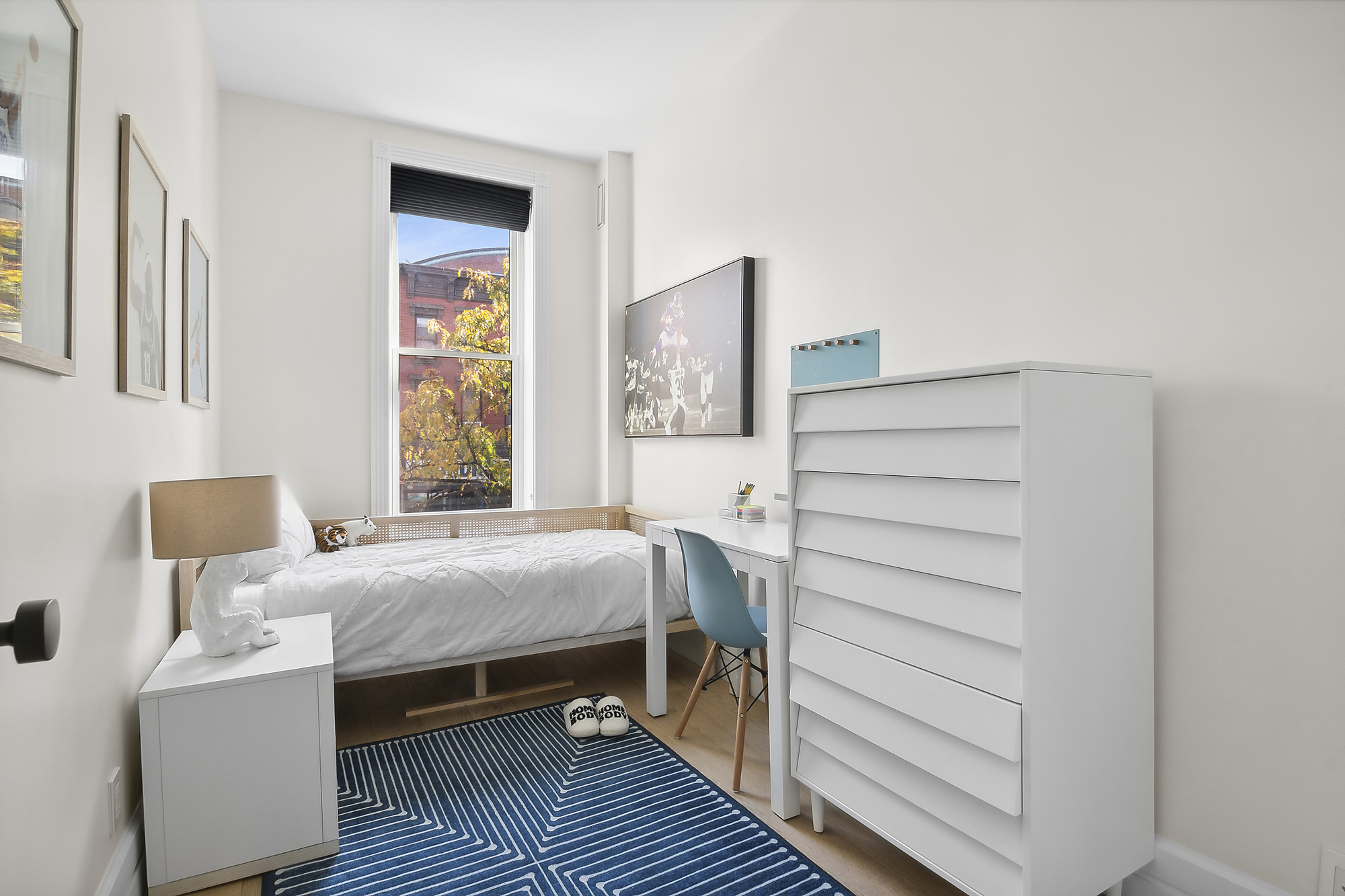 374 14th Street Brooklyn, NY 11215 - Photo 10 of 11 a bedroom with a bed and a table