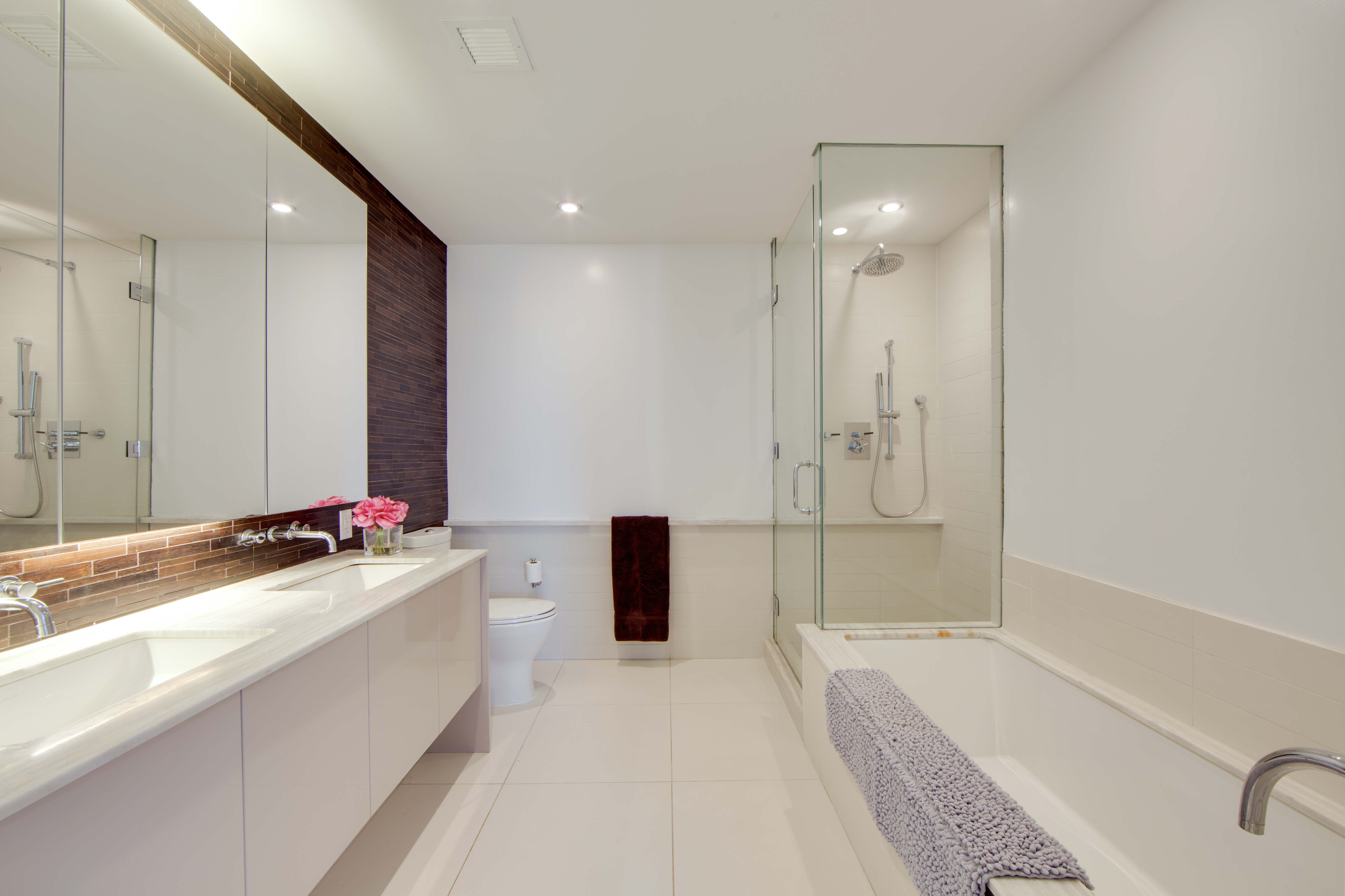 2 Northside Piers, Unit 8H Brooklyn, NY 11249 - Photo 10 of 20 a bathroom with a tub sink and mirror