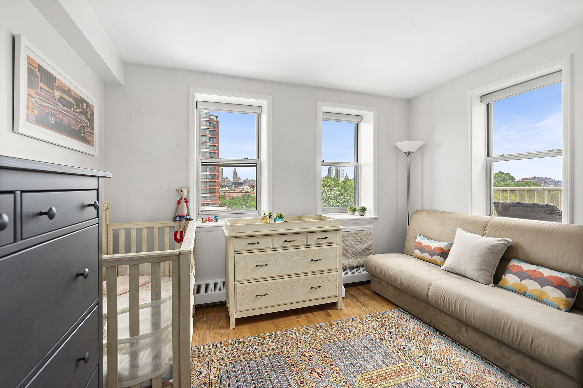 1831 Madison Avenue, Unit 9E Manhattan, NY 10035 - Photo 7 of 18 a bedroom with furniture and a window