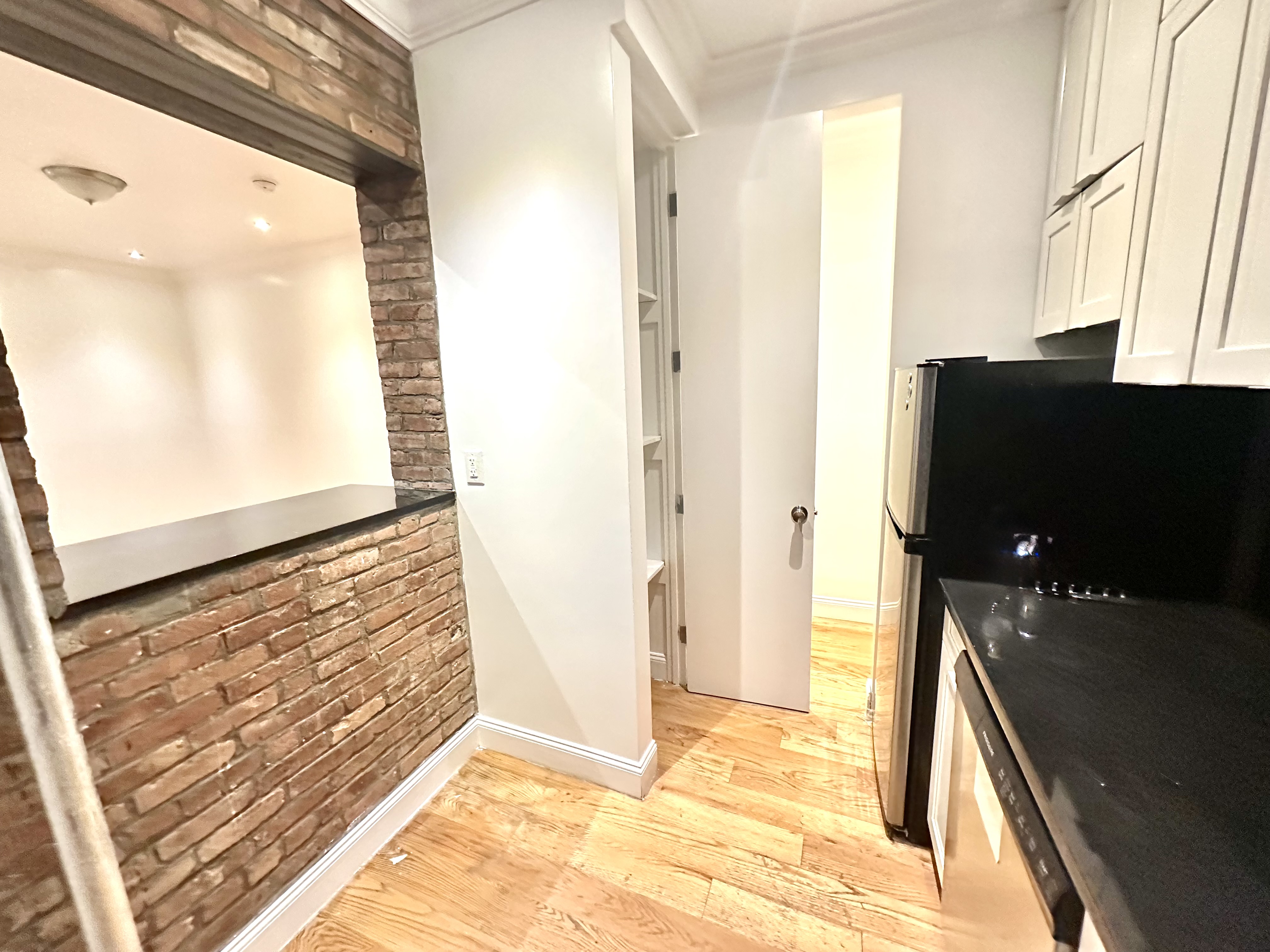 541 West 144th Street, Unit 4 Manhattan, NY 10031 - Photo 3 of 9 a view of a living room with a large window