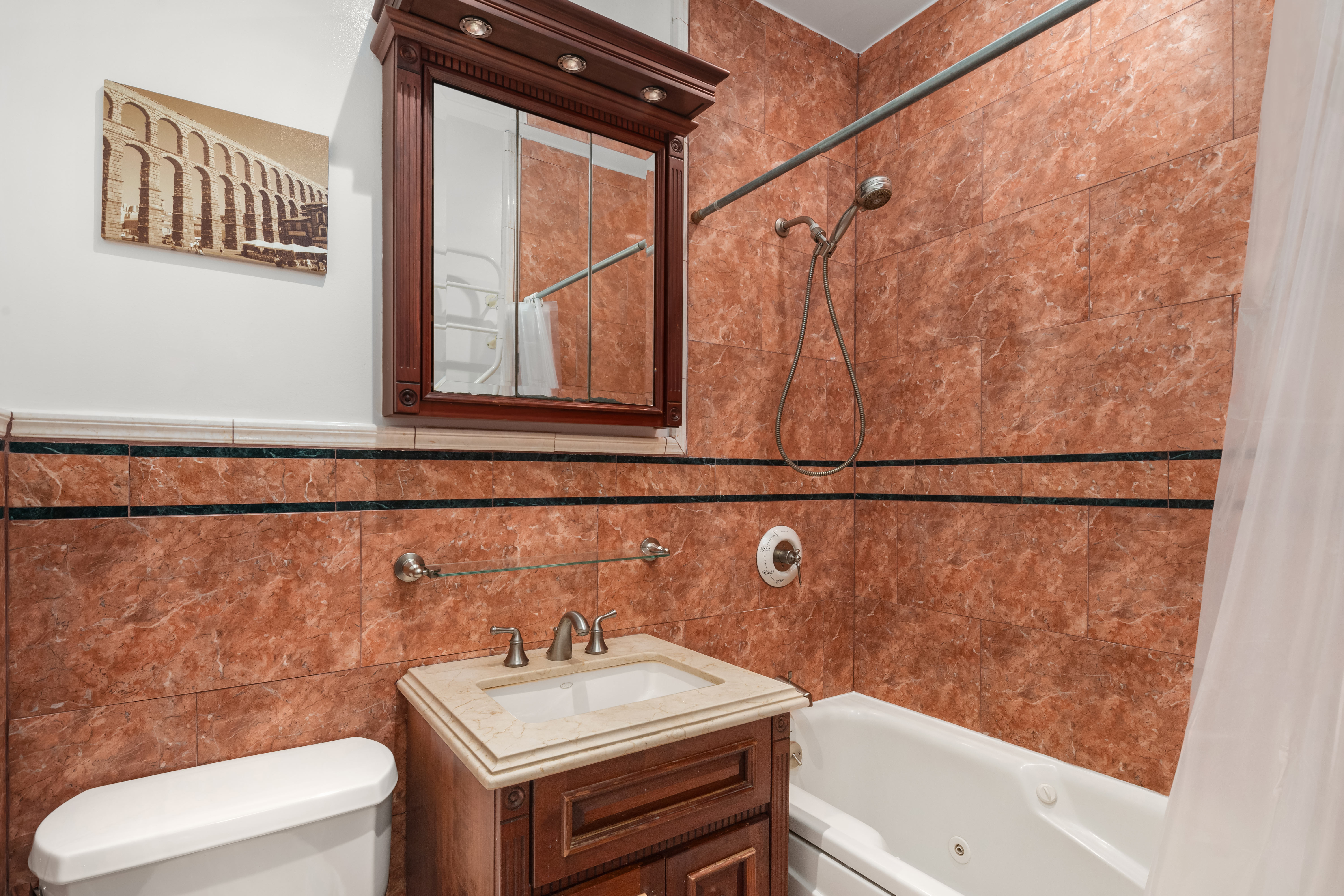 3 Hanover Square, Unit 4E Manhattan, NY 10004 - Photo 5 of 7 a bathroom with a sink toilet and shower