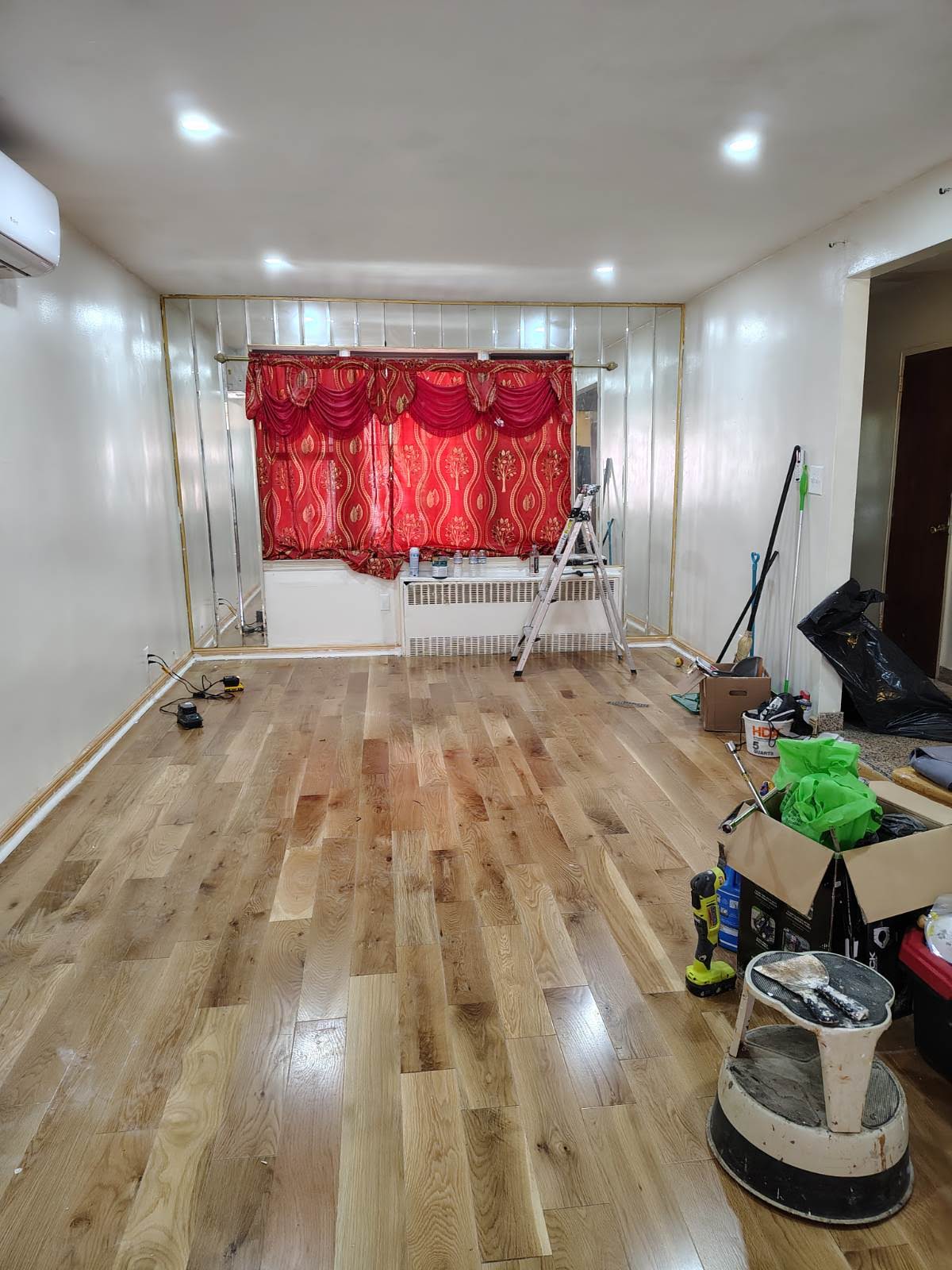 552 East 53rd Street, Unit 2 Brooklyn, NY 11203 - Photo 2 of 4 a room with gym equipment and a large mirror