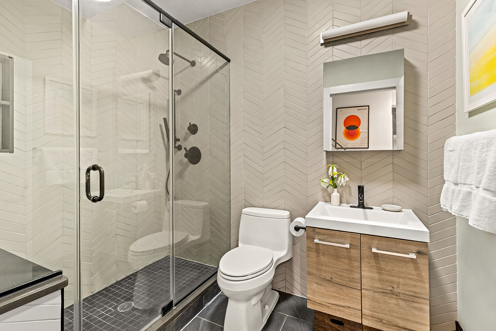 516 Classon Avenue, Unit 1B Brooklyn, NY 11238 - Photo 15 of 17 a bathroom with a toilet sink vanity and shower