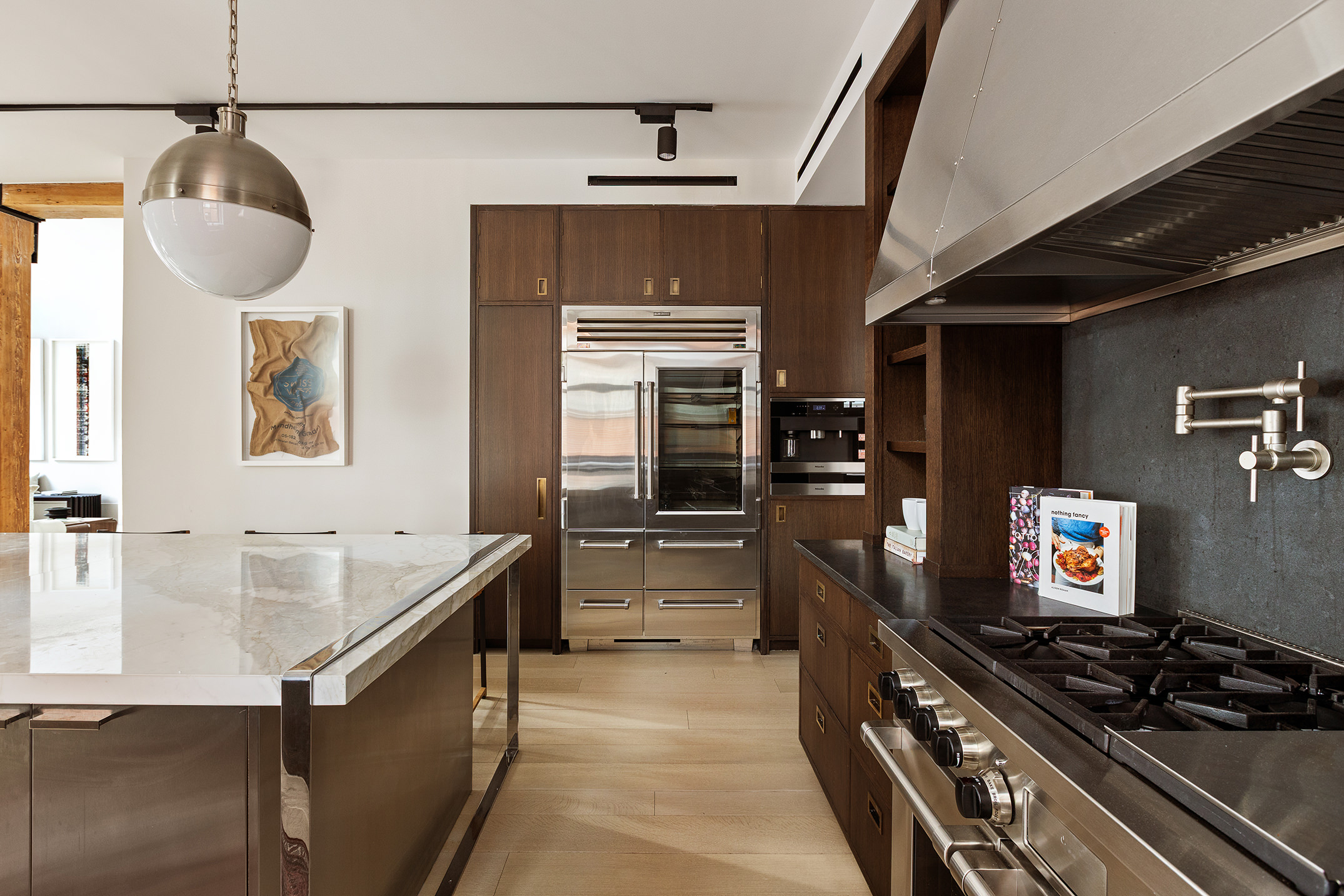 443 Greenwich Street, Unit PHD Manhattan, NY 10013 - Photo 10 of 32 a kitchen with sink cabinets and stove