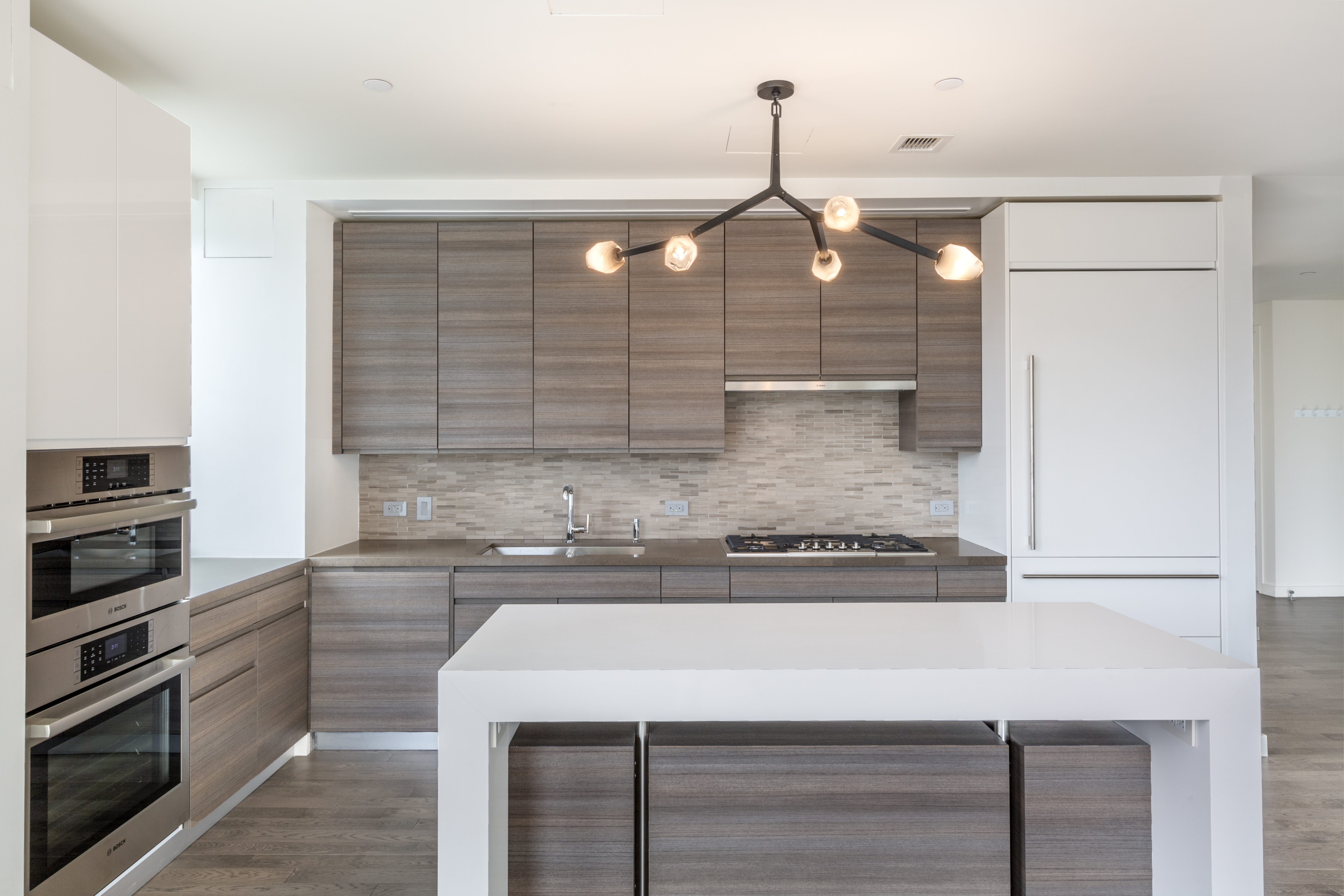 285 West 110th Street, Unit 7B Manhattan, NY 10026 - Photo 4 of 10 a kitchen with a sink stainless steel appliances and cabinets