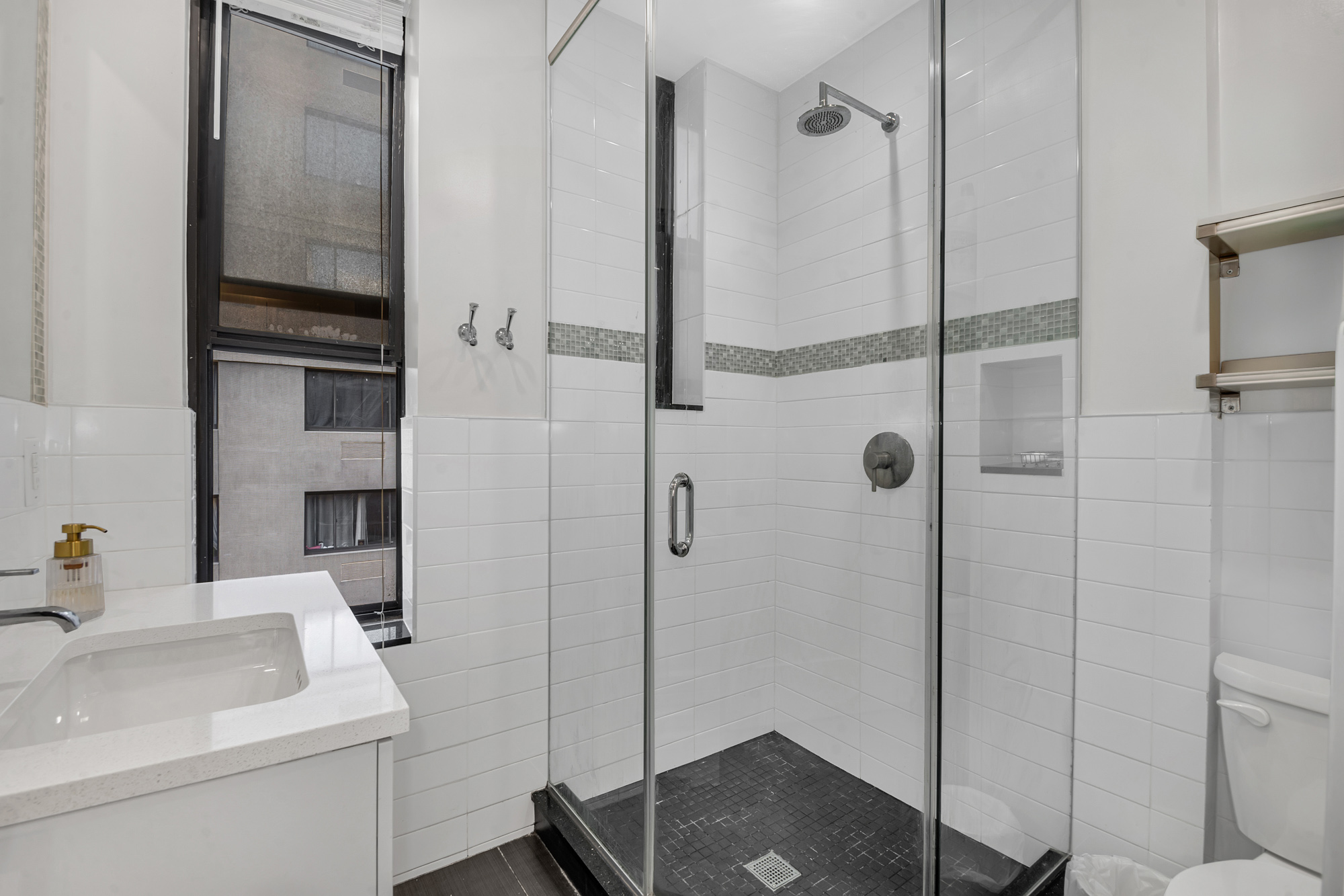 244 Riverside Drive, Unit 5K Manhattan, NY 10025 - Photo 6 of 8 a bathroom with a sink toilet and shower