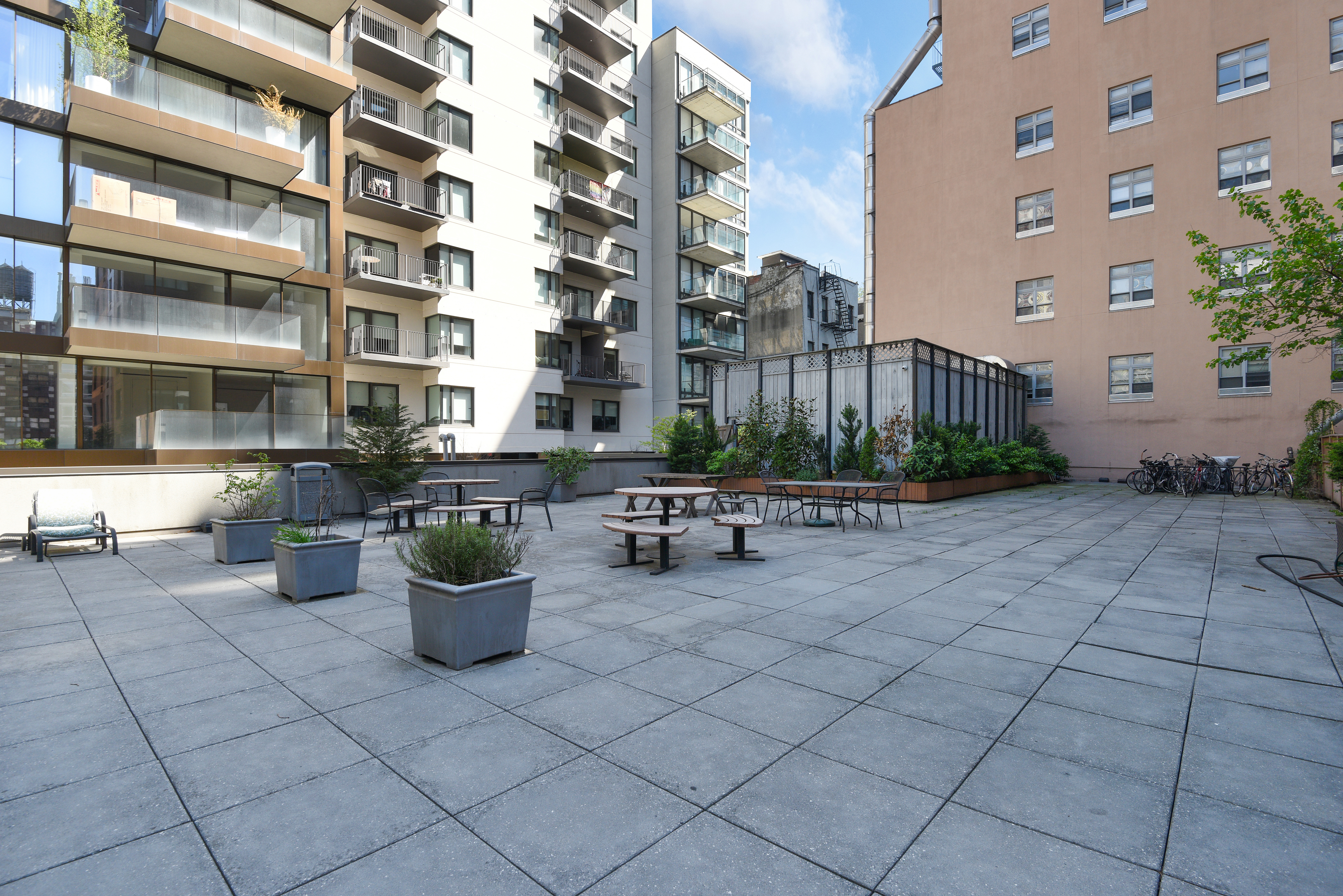 199 Bowery, Unit 11F Manhattan, NY 10002 - Photo 12 of 13 a view of a patio with plants and chairs