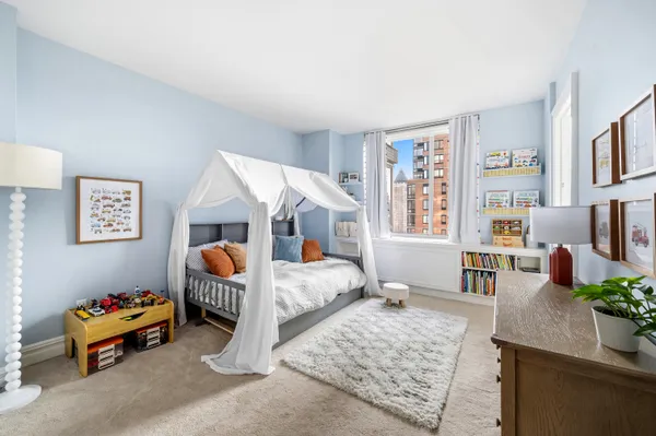 a bedroom with furniture and a bed