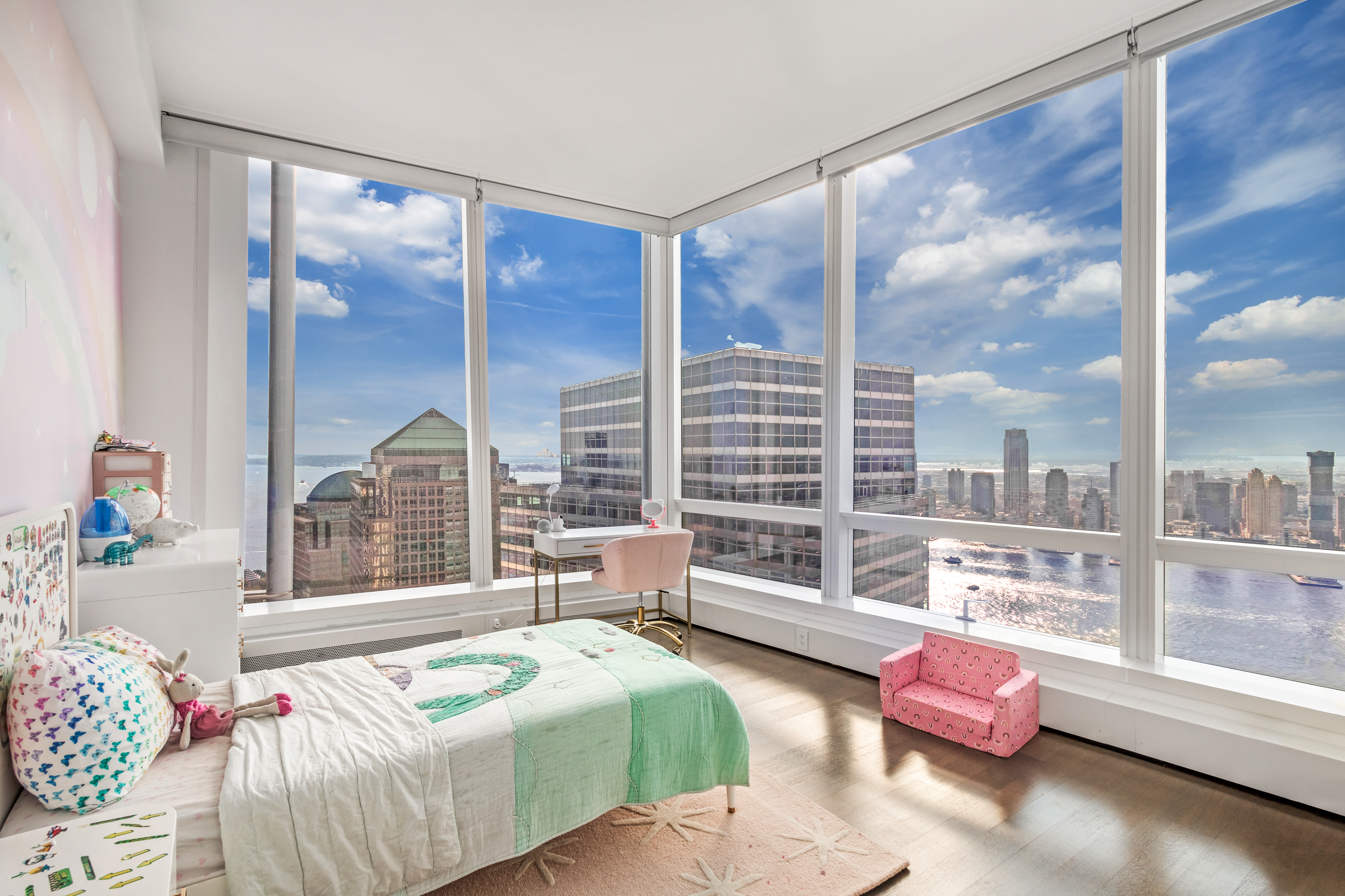 111 Murray Street, Unit 61W Manhattan, NY 10007 - Photo 23 of 35 a bedroom with furniture and a large window
