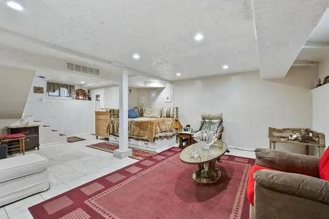 a living room with furniture and a table