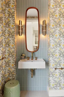 a bathroom with a sink toilet and mirror