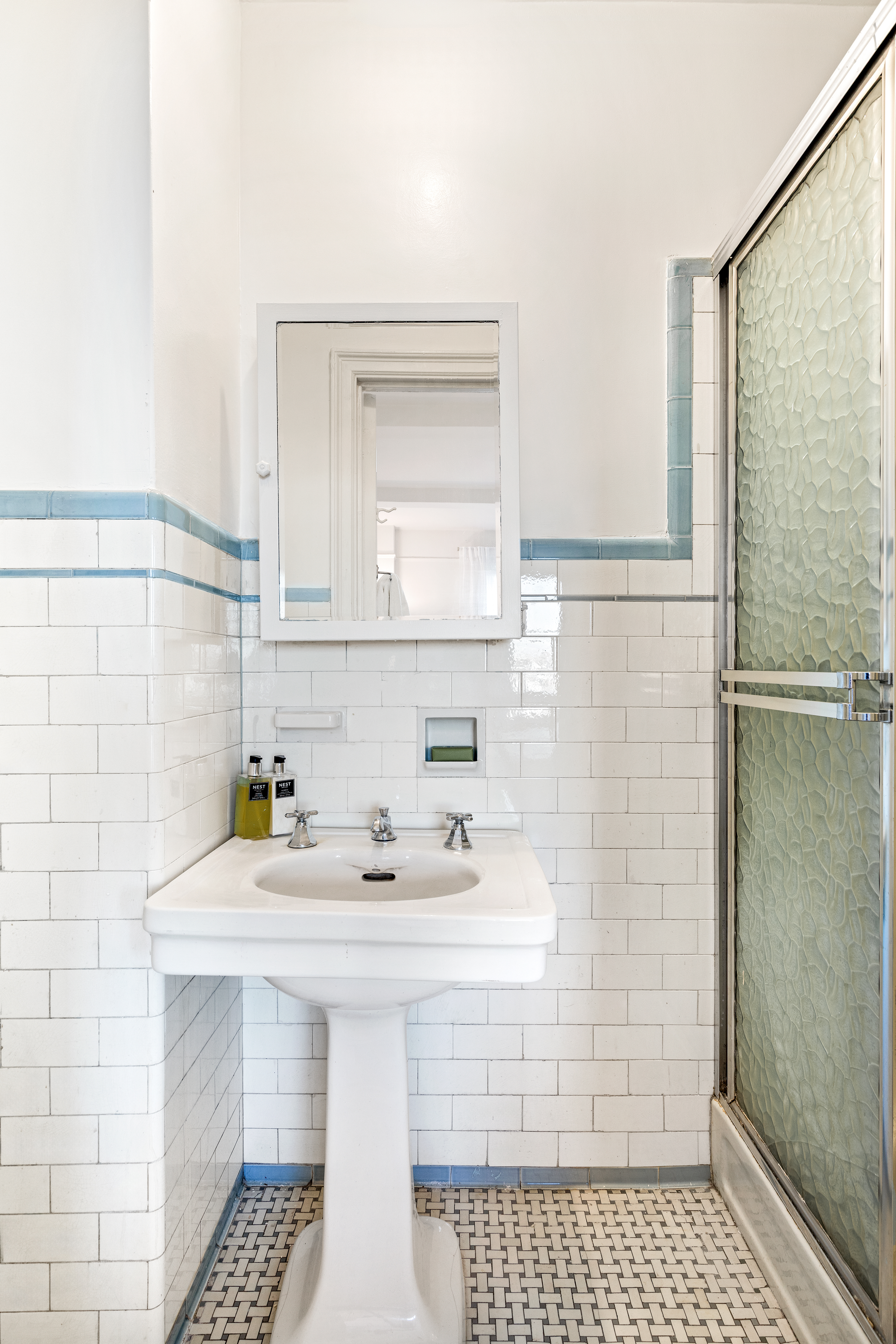 320 Riverside Drive, Unit 10G Manhattan, NY 10025 - Photo 10 of 16 a bathroom with a sink a toilet and shower